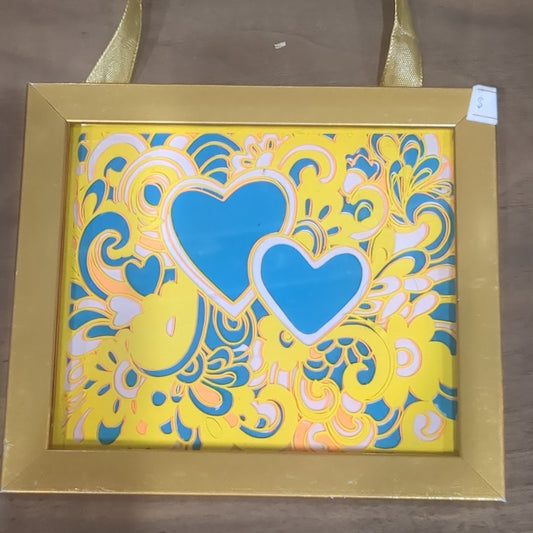 Roughly 5 x 6” gold shadowbox with paper cut Paisley heart