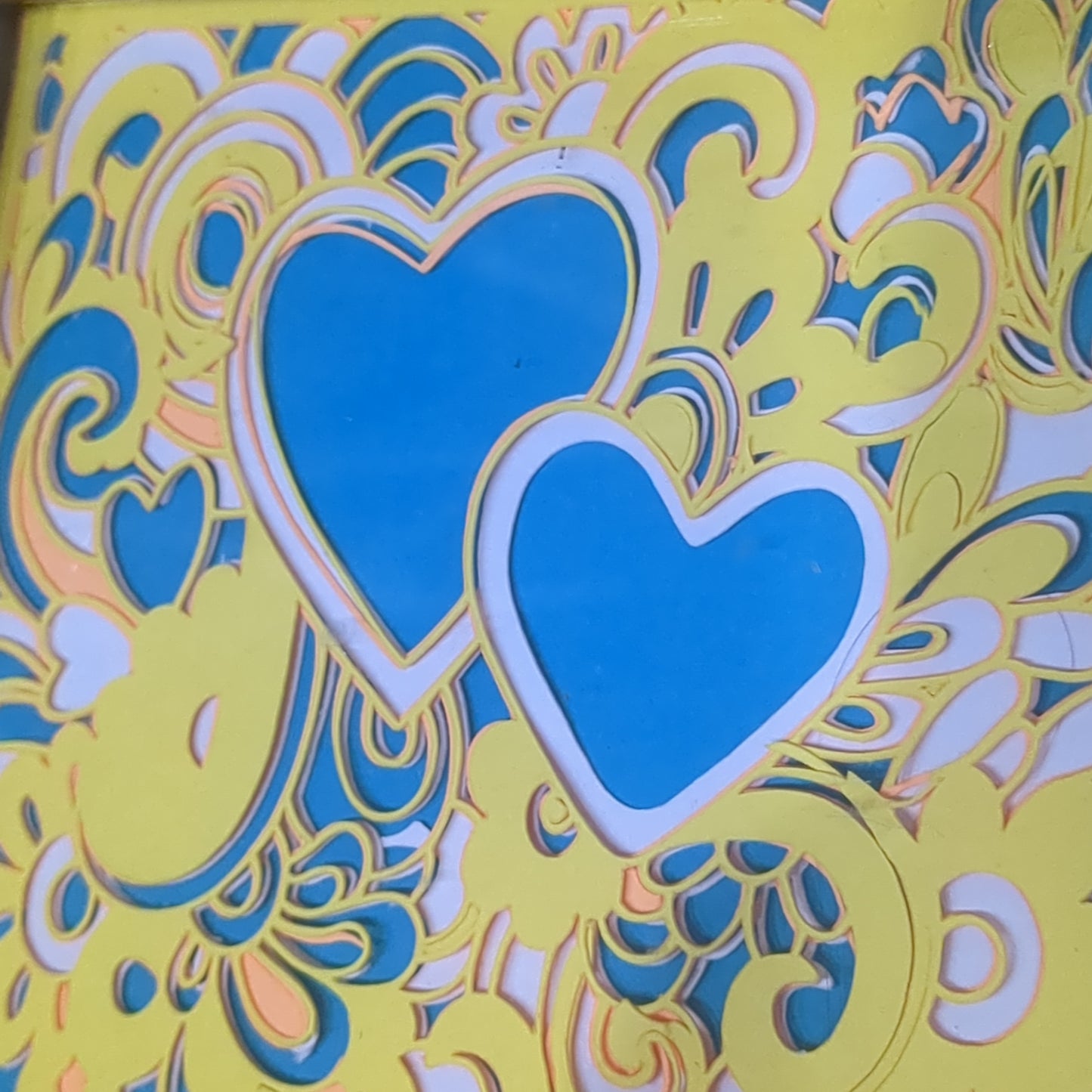 Roughly 5 x 6” gold shadowbox with paper cut Paisley heart