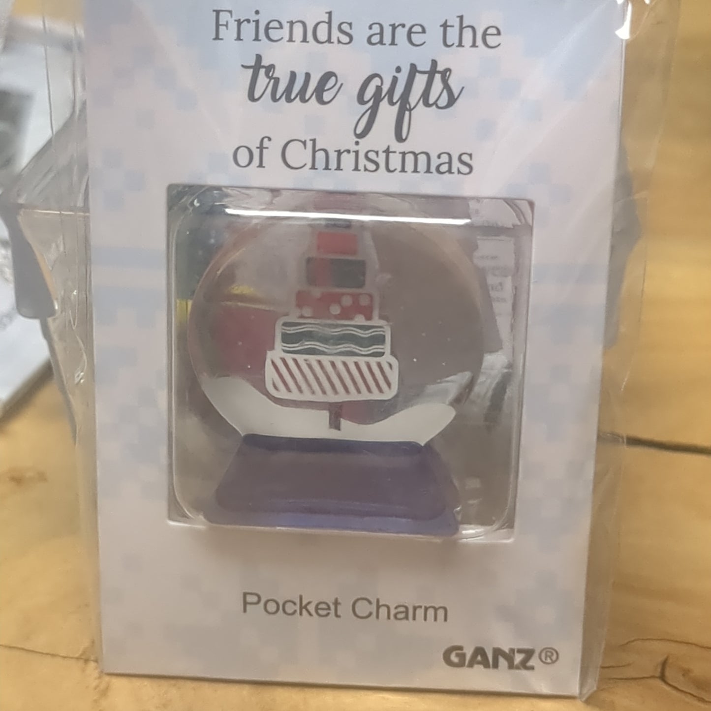 Pocket charm snow globe appearance with tree inside. friends are the true gifts of Christmas.