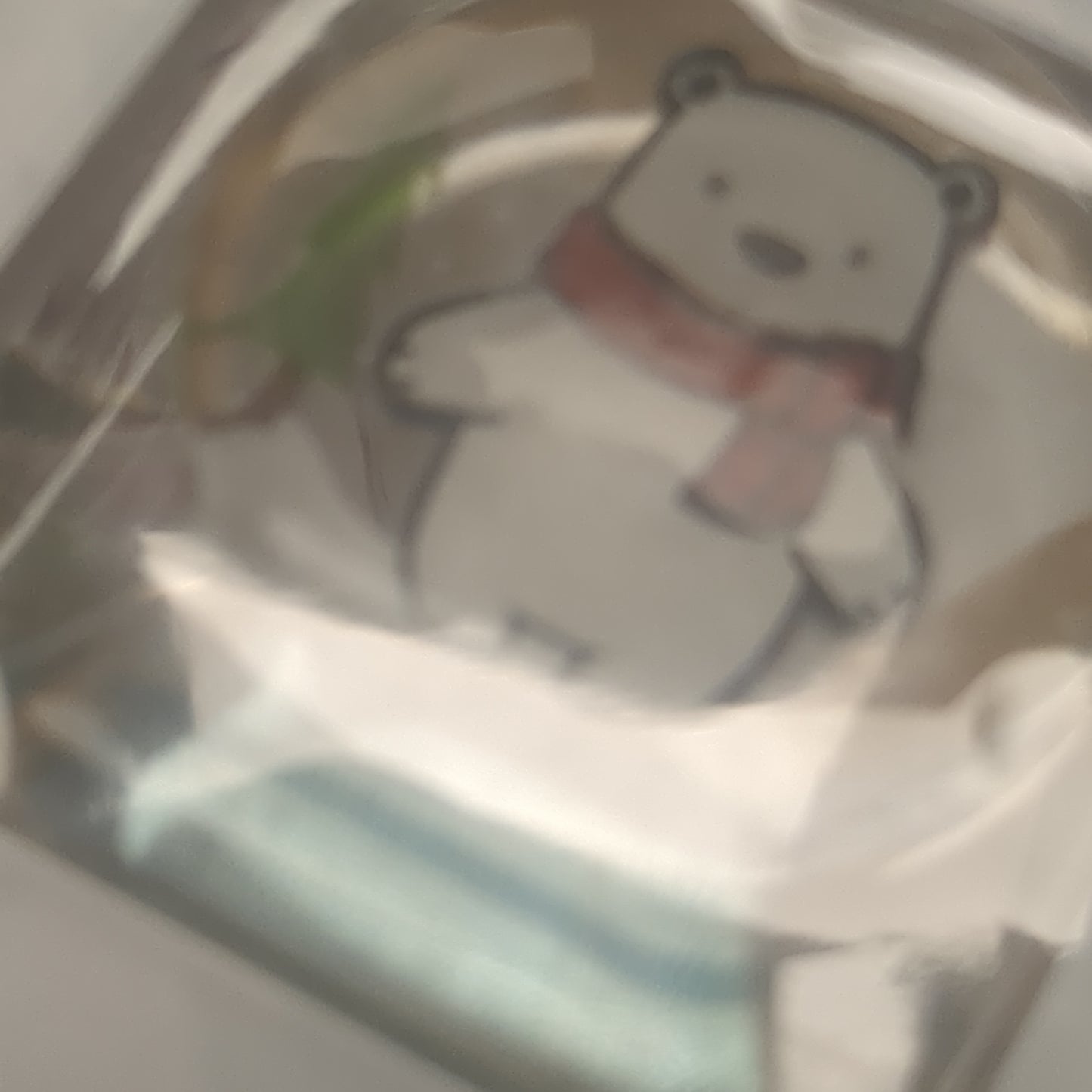 Pocket charm snow globe appearance with polar bear inside. Christmas warms the heart