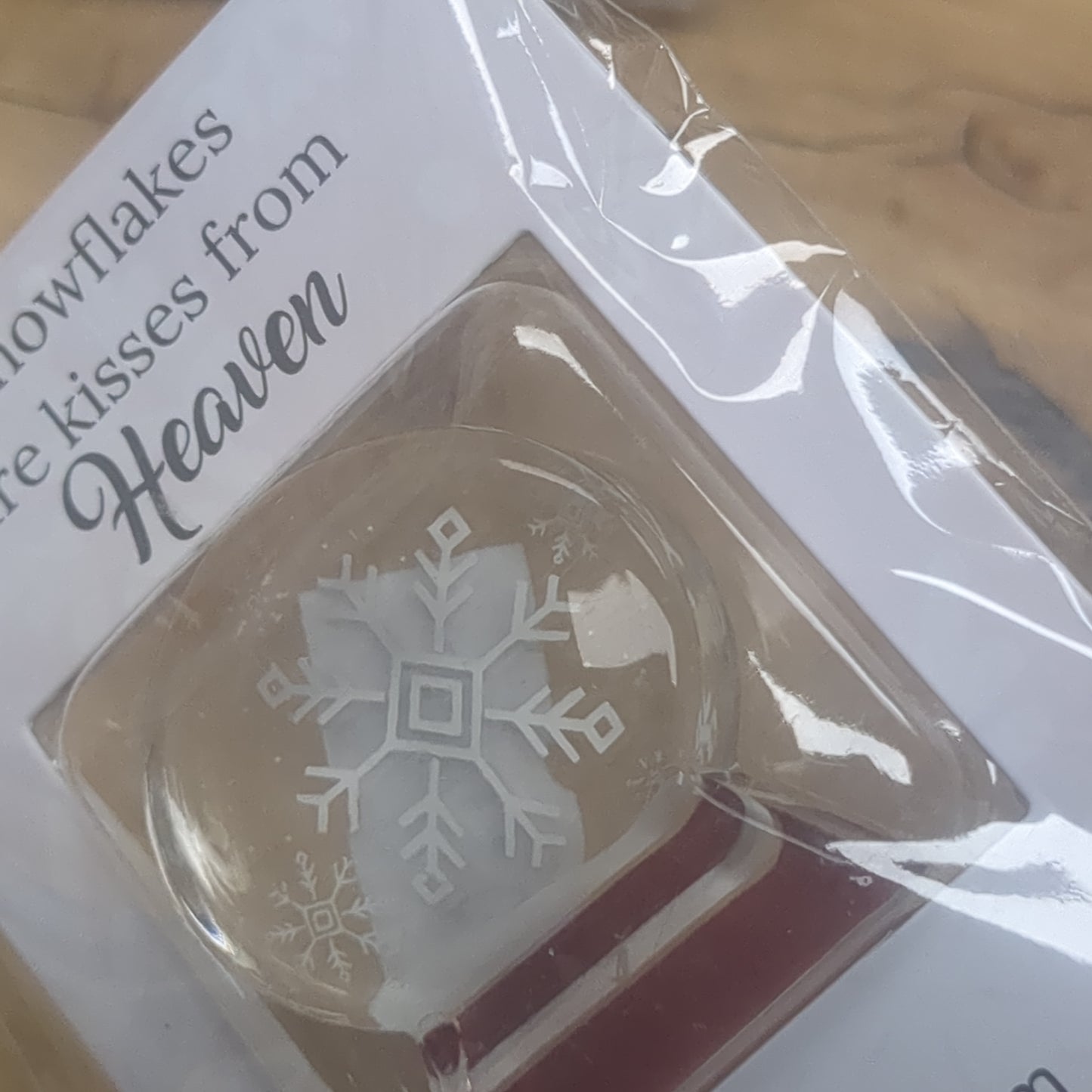 Pocket charm snow globe appearance with snowflake inside. Snowflakes are kisses from heaven