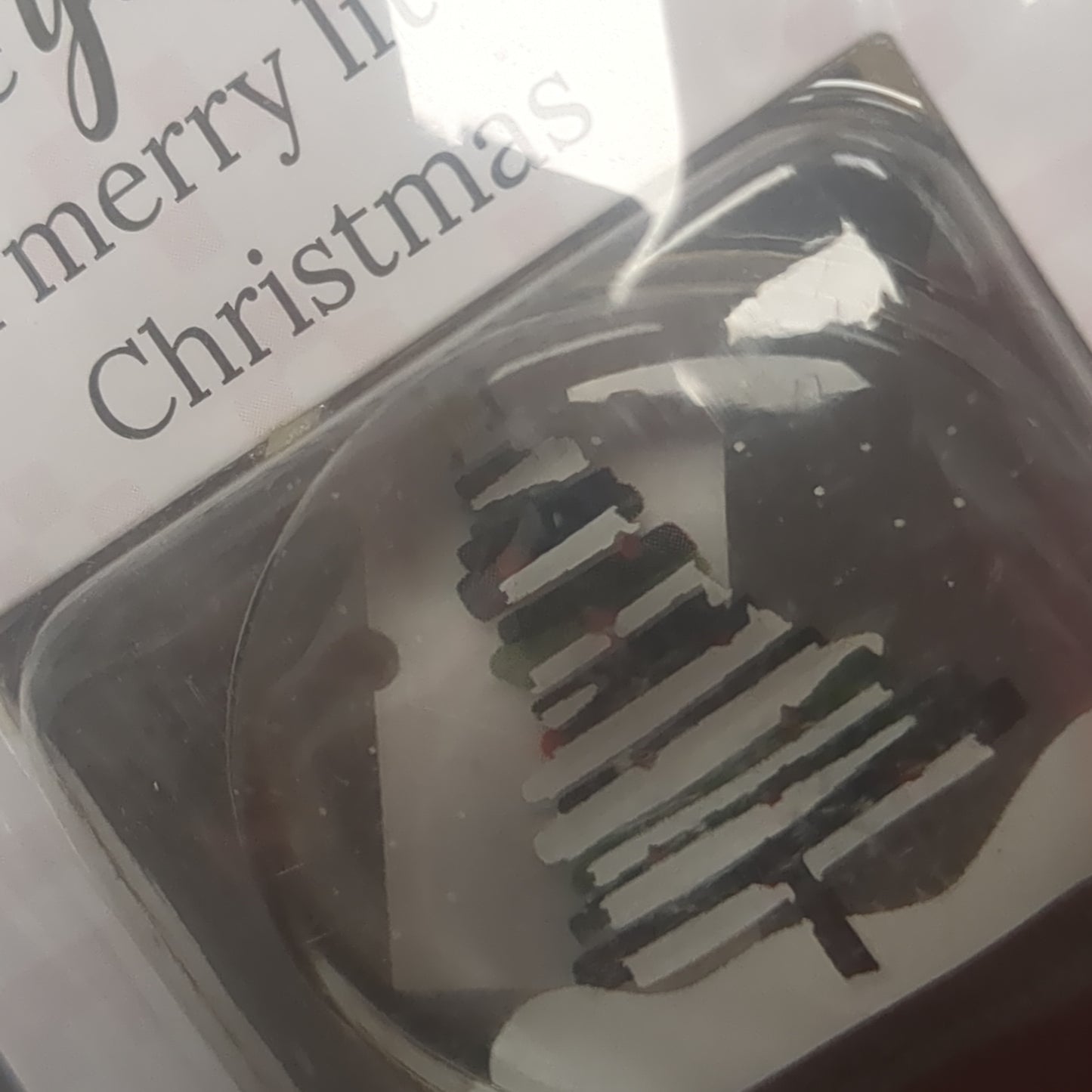 Pocket charm snow globe appearance with tree inside. Have yourself a Merry Little Christmas