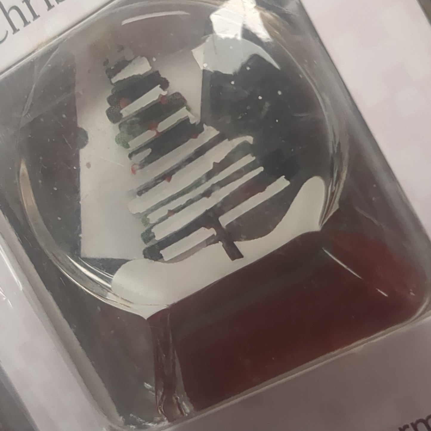 Pocket charm snow globe appearance with tree inside. Have yourself a Merry Little Christmas