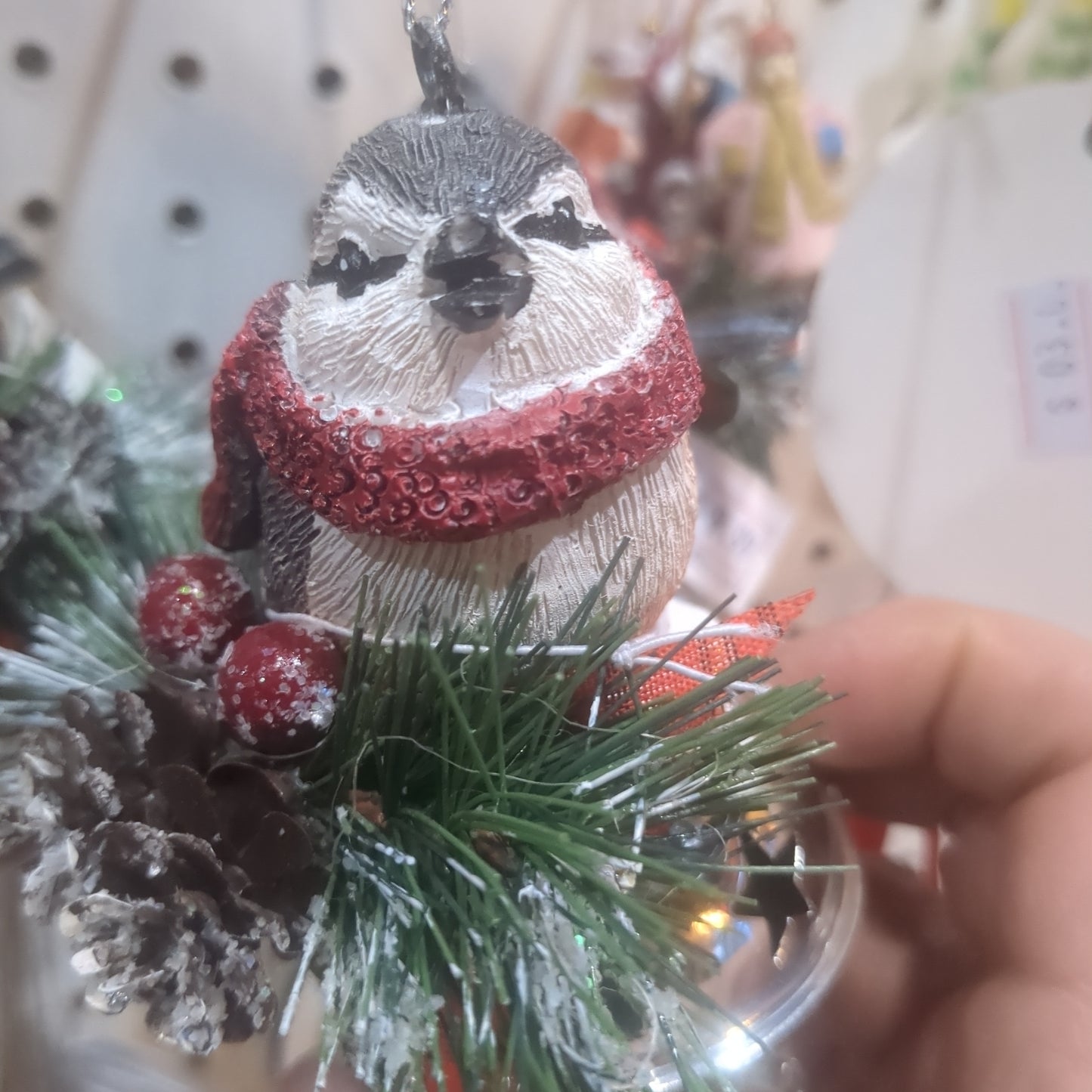 Bird on bell ornament