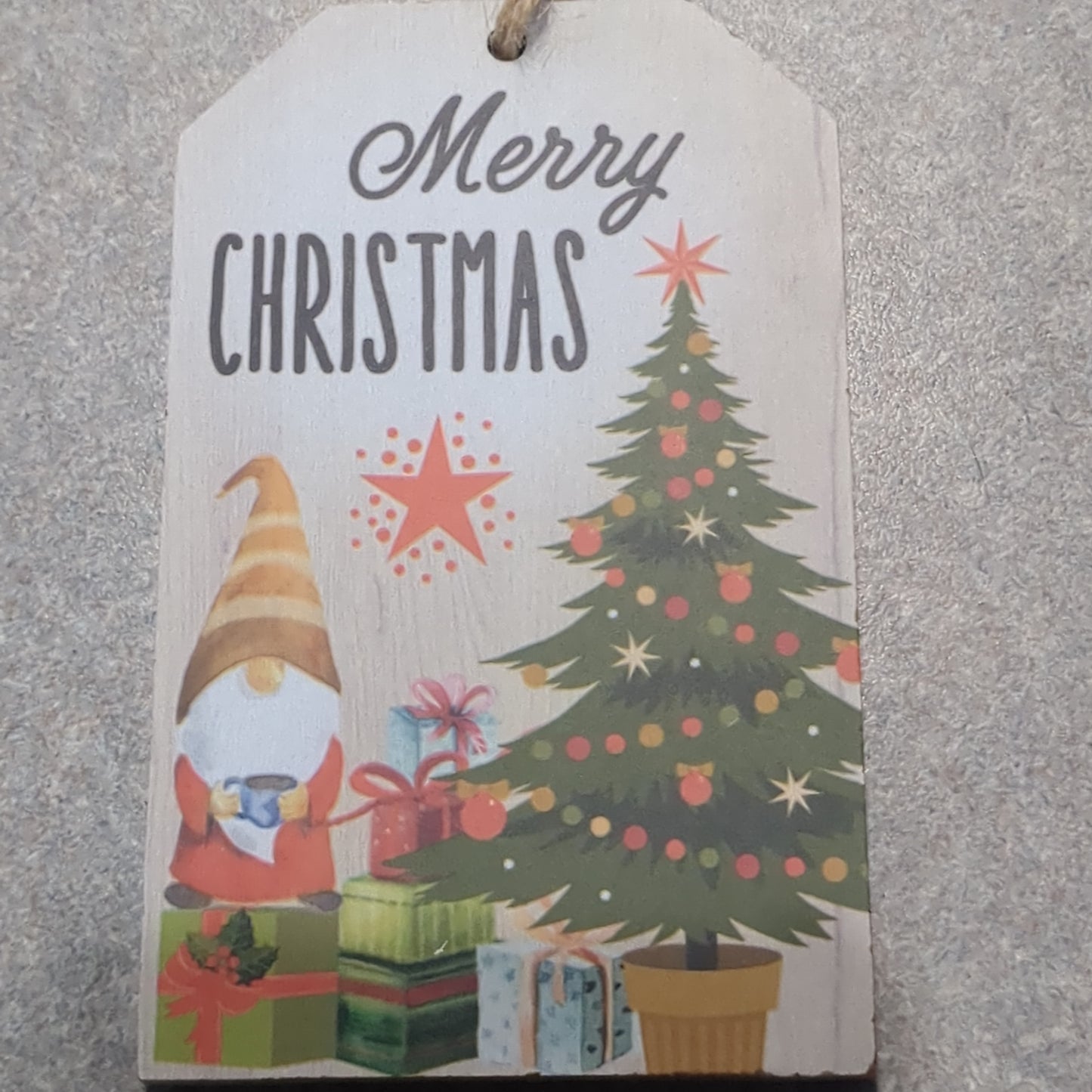 Tag ornaments Merry Christmas. It has a gnome