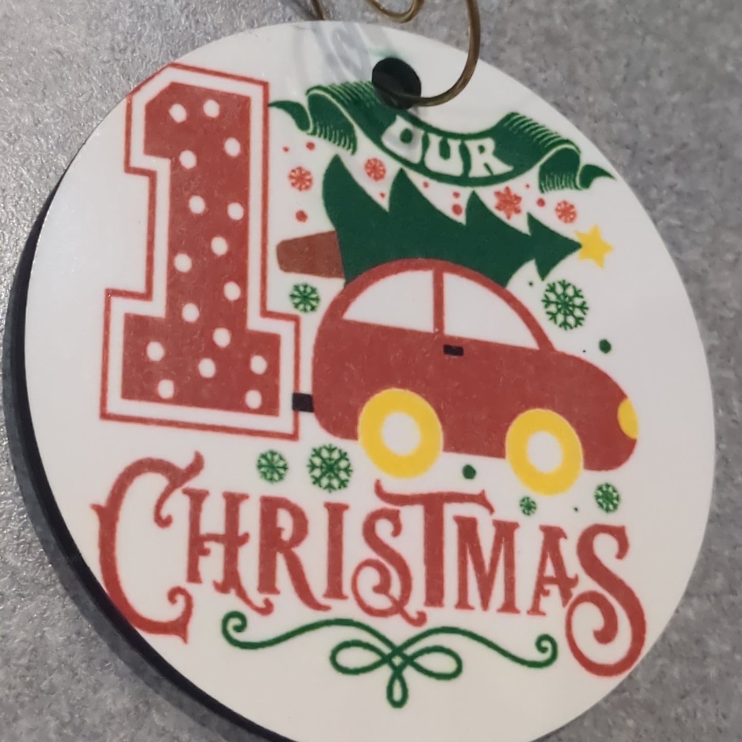 MDF ornament our first Christmas with a tree tied to the top of the car