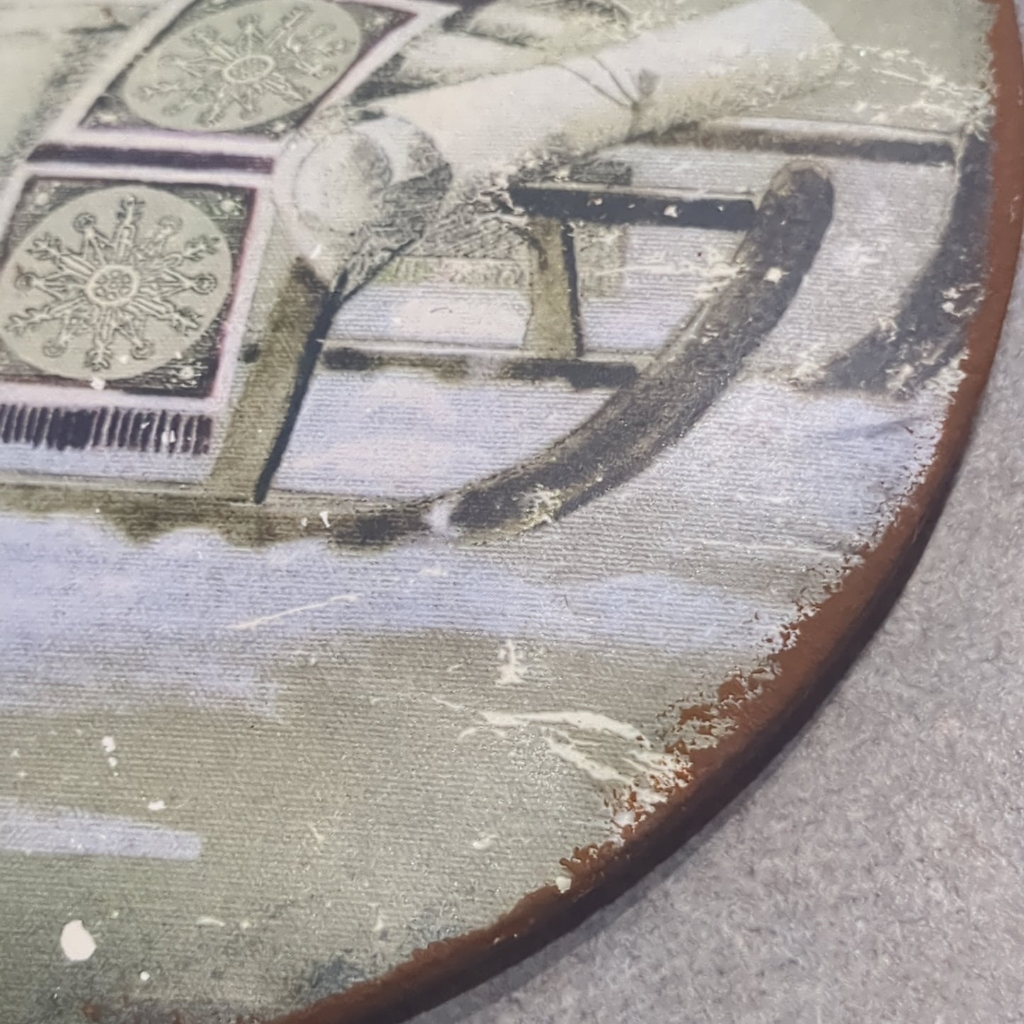 6 inch tin ornament with a sled