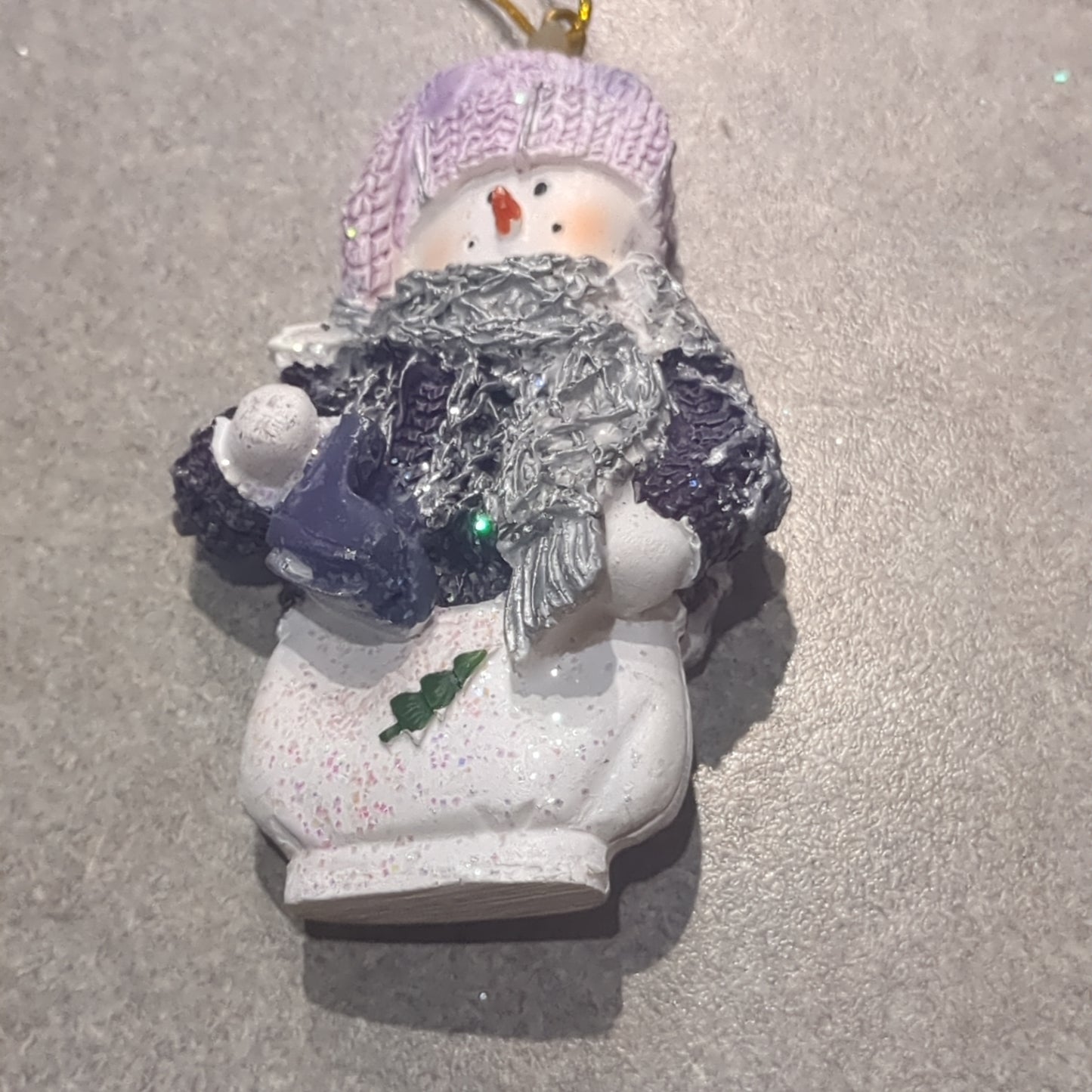 Op2 Polycrylic snowman ornament with an ice skate lilac and purple