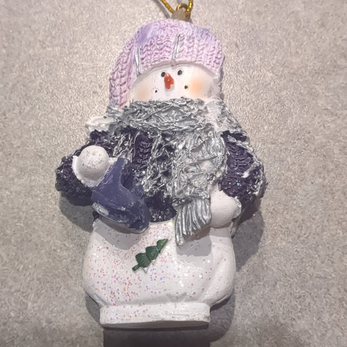 Op2 Polycrylic snowman ornament with an ice skate lilac and purple