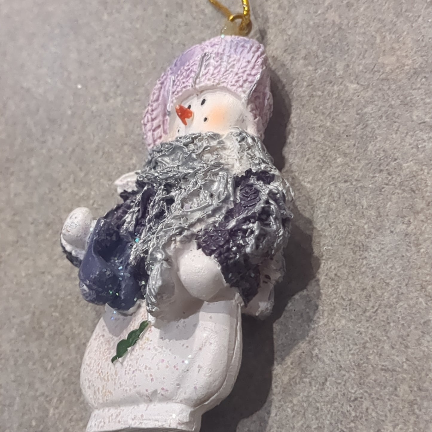 Op2 Polycrylic snowman ornament with an ice skate lilac and purple