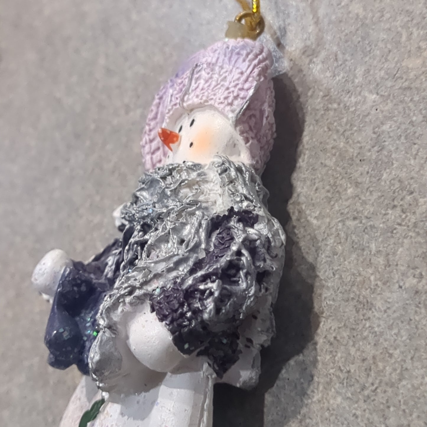 Op2 Polycrylic snowman ornament with an ice skate lilac and purple