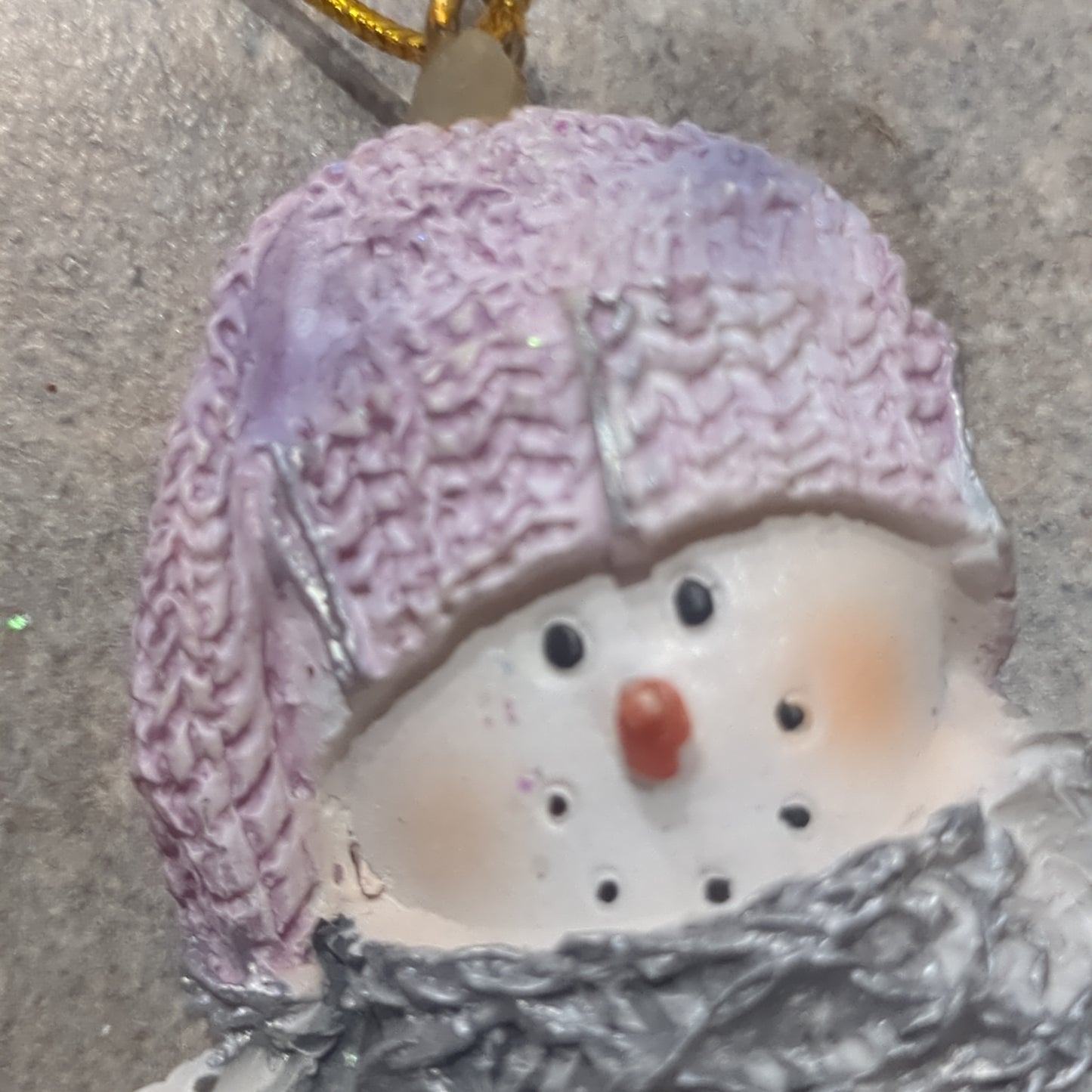 Op2 Polycrylic snowman ornament with an ice skate lilac and purple