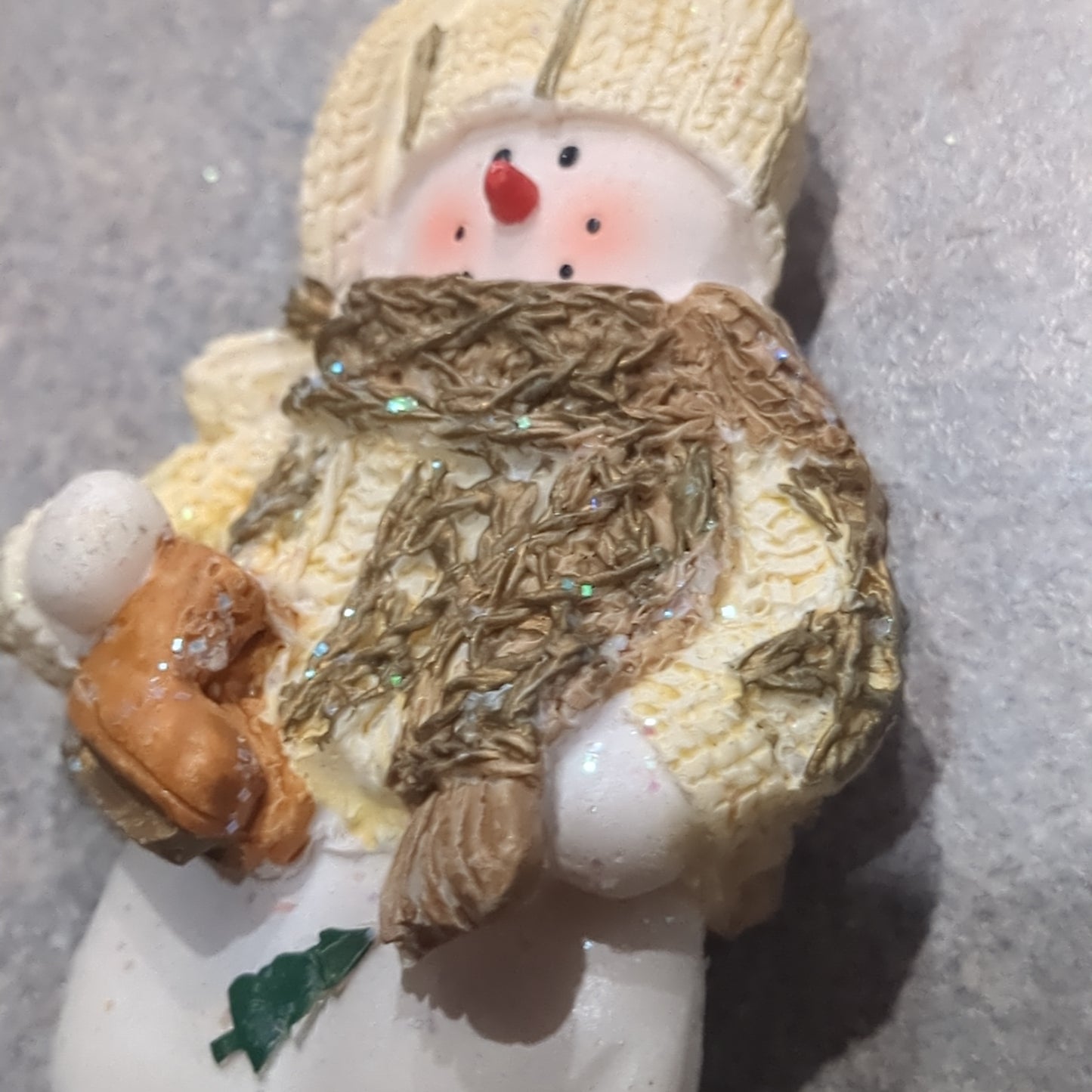 Oy5 Polycrylic snowman ornament with an ice skate yellow