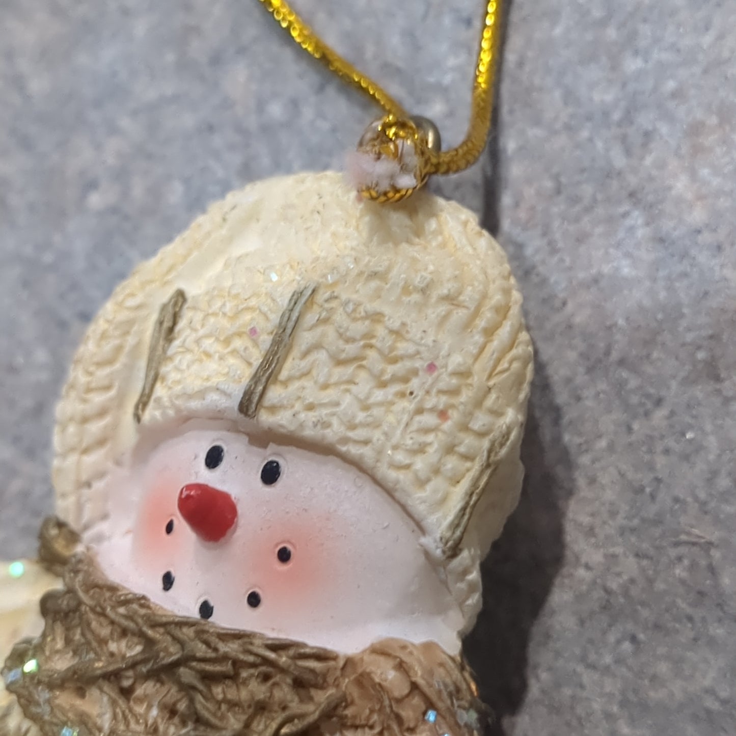 Oy5 Polycrylic snowman ornament with an ice skate yellow