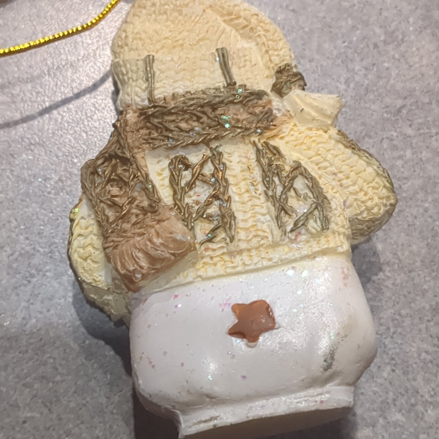 Oy5 Polycrylic snowman ornament with an ice skate yellow