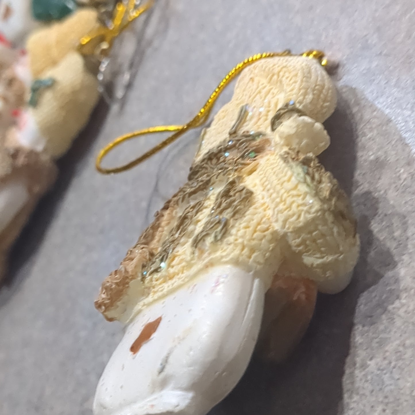 Oy5 Polycrylic snowman ornament with an ice skate yellow