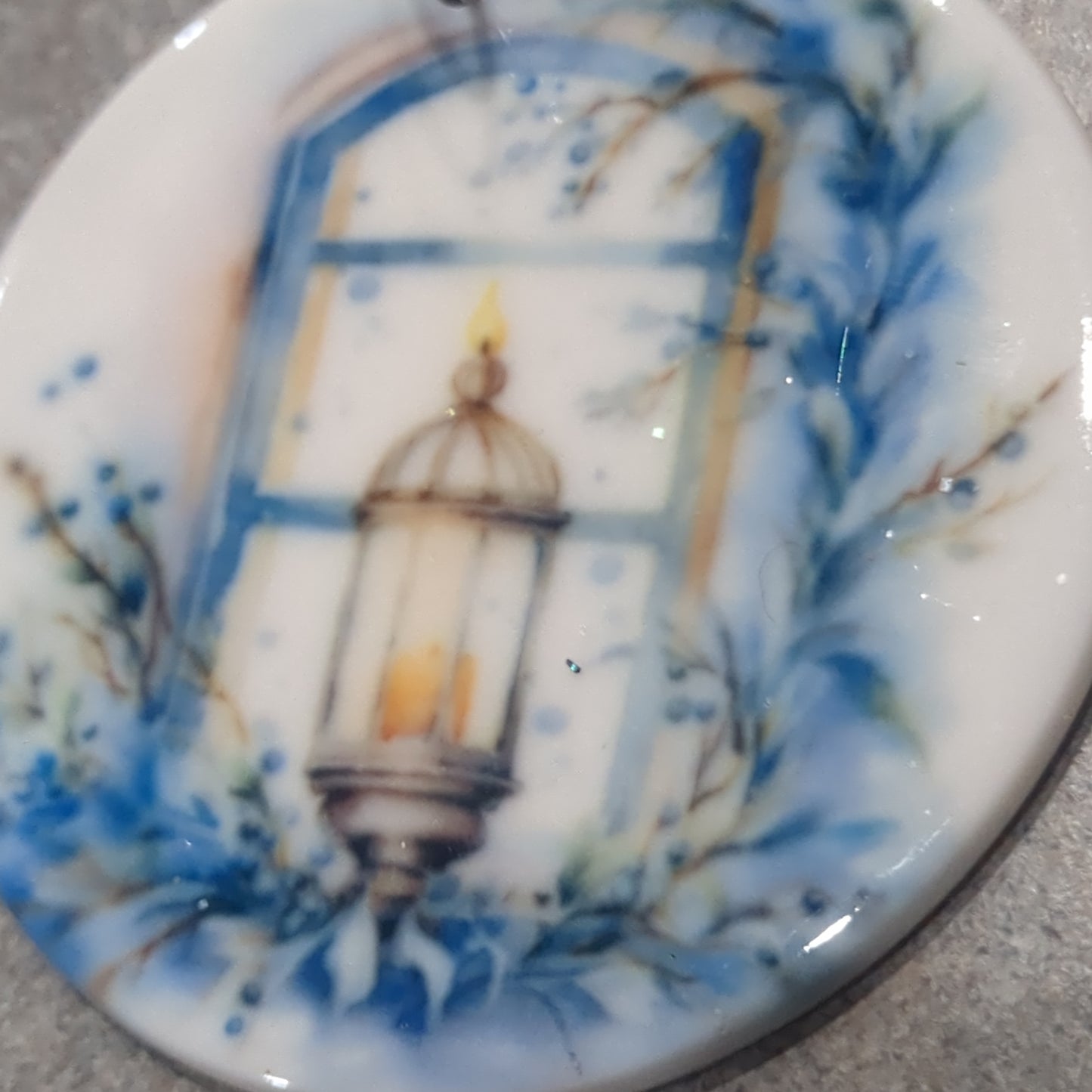 Ceramic ornament blue and white lantern in a window