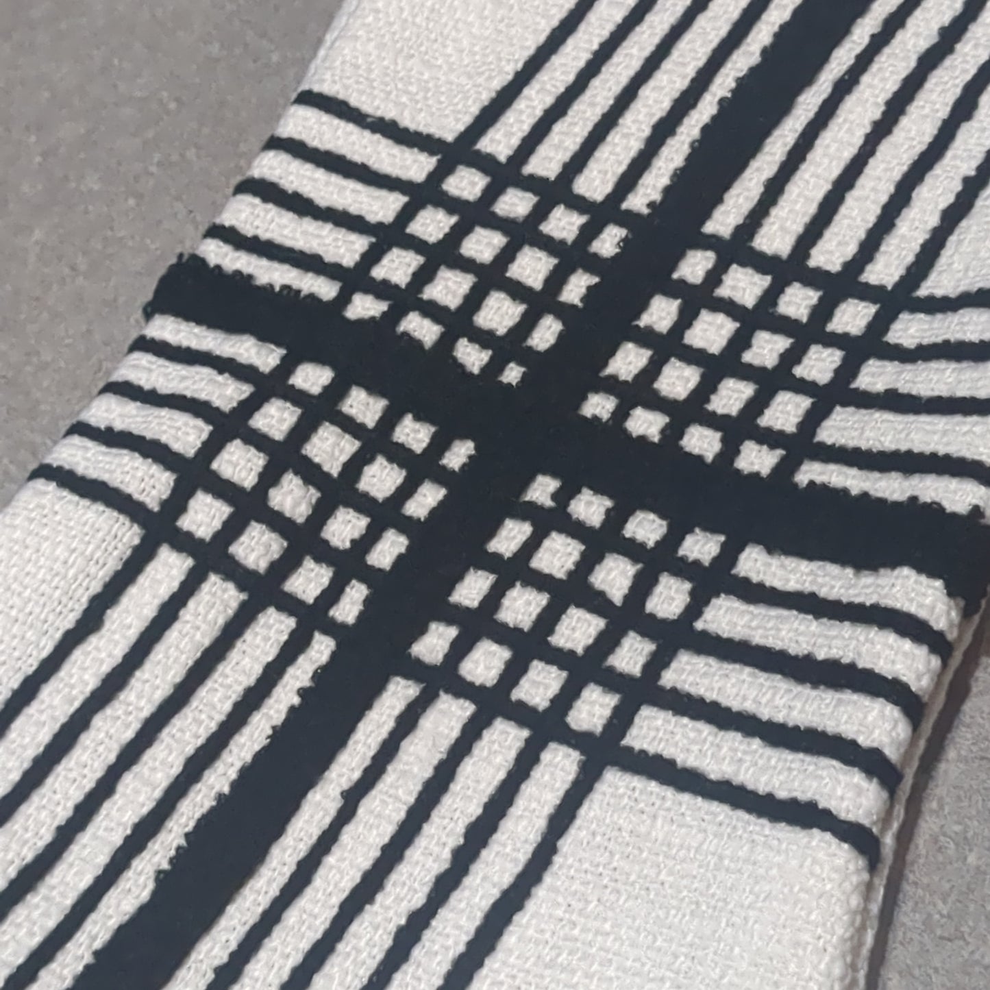 Stocking white with black stripes.