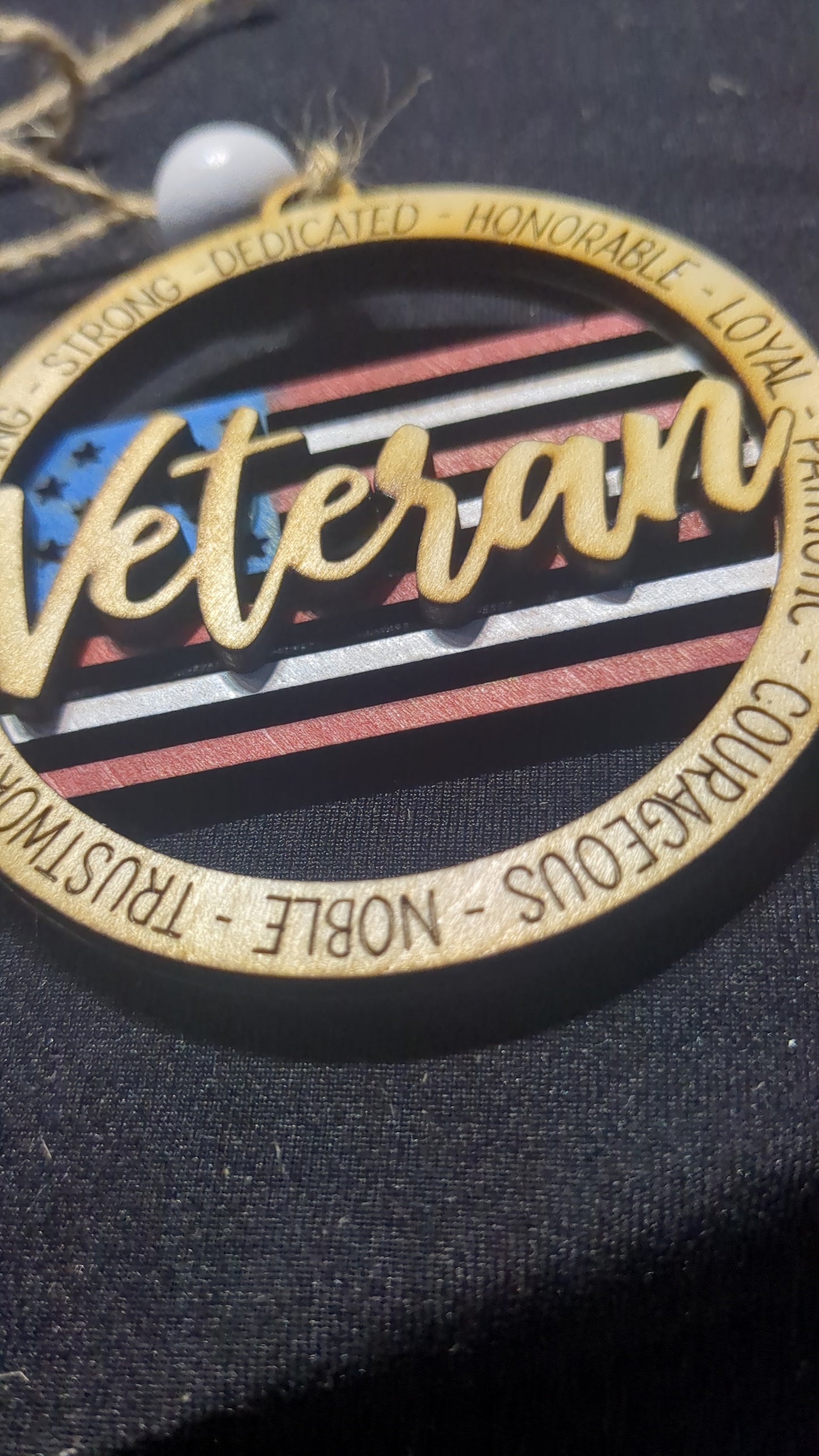Wooden ornament or car charm. Veteran