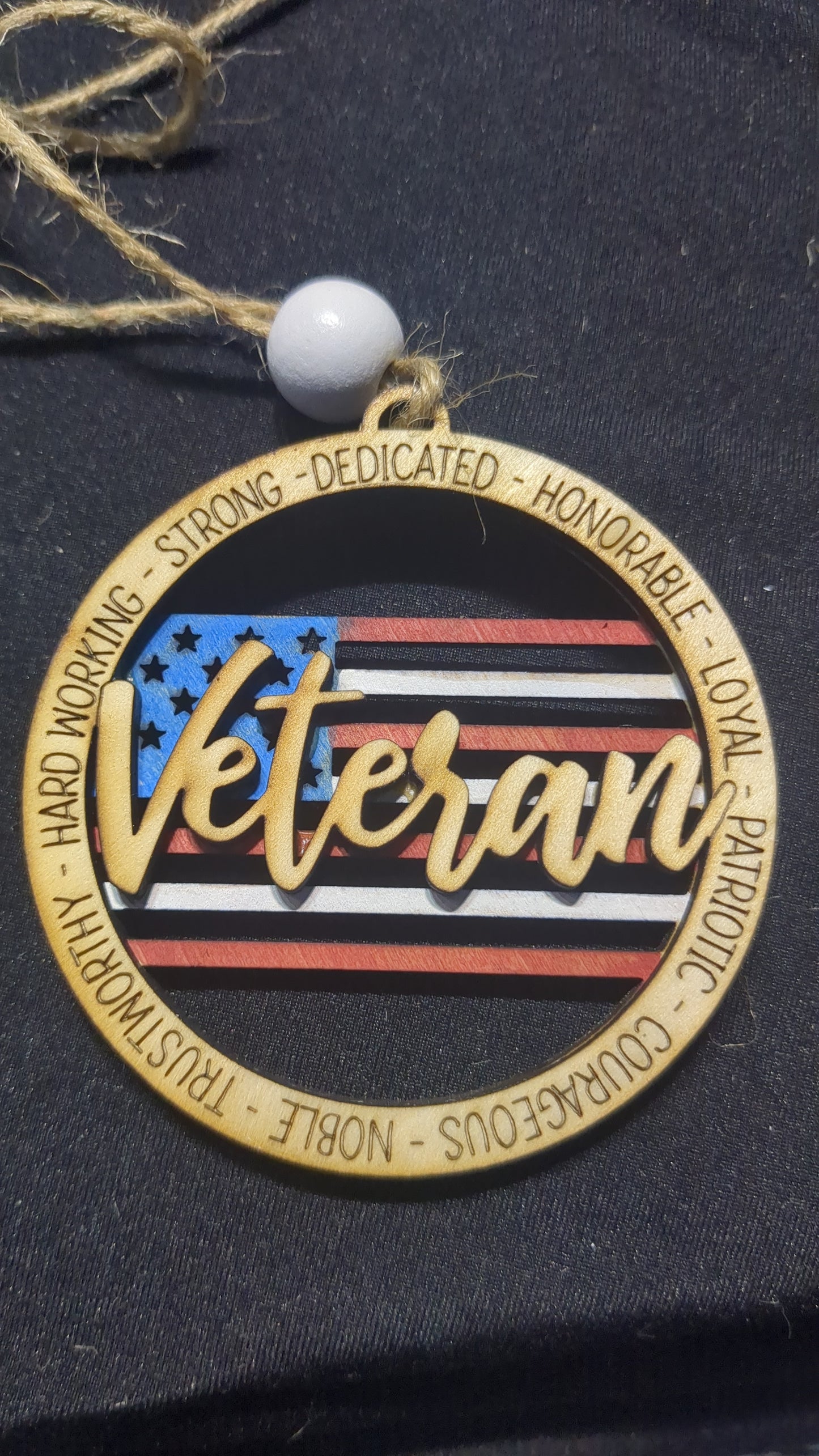 Wooden ornament or car charm. Veteran