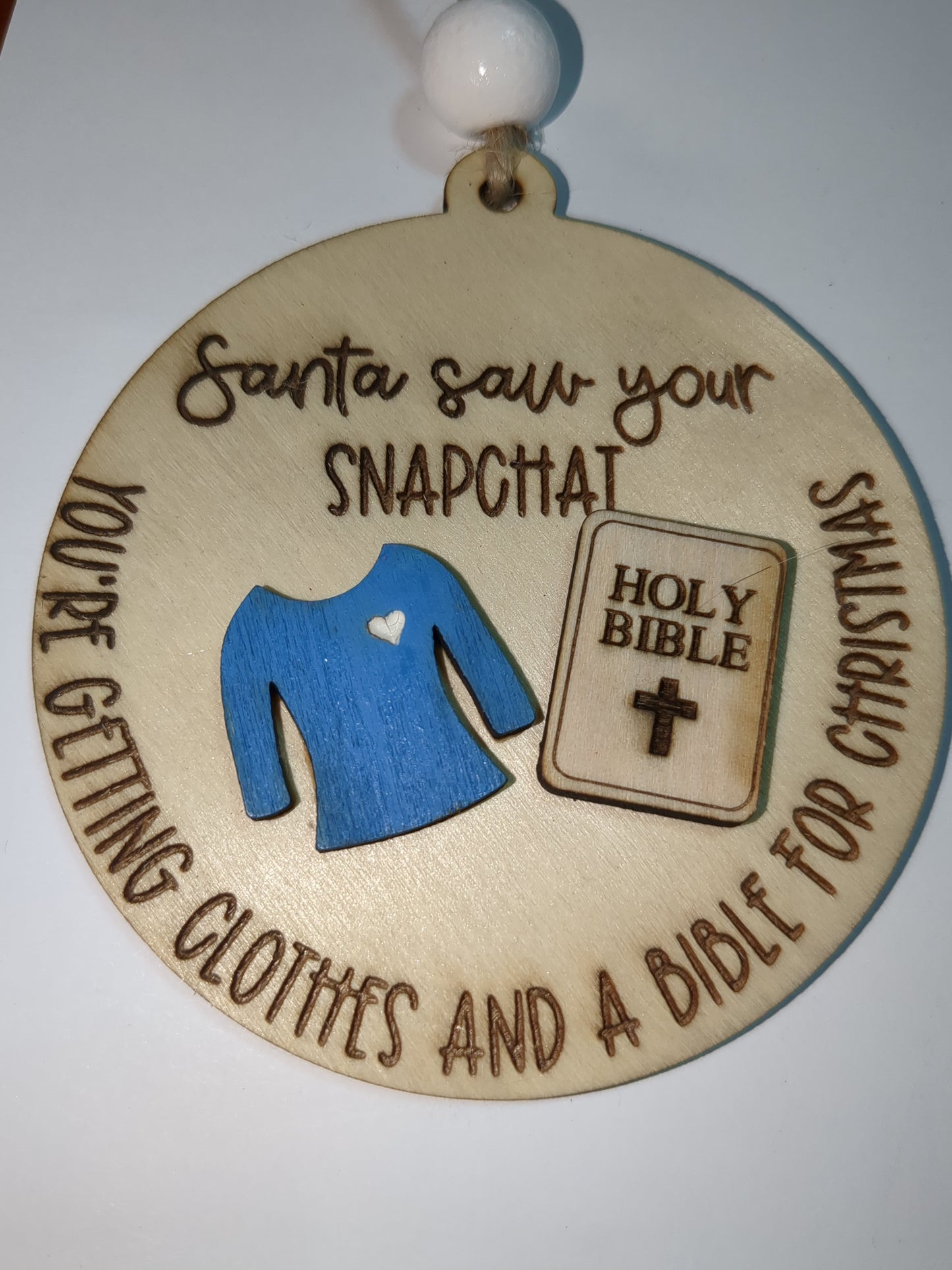 Ornament or car charm.  Santa saw your Snapchat