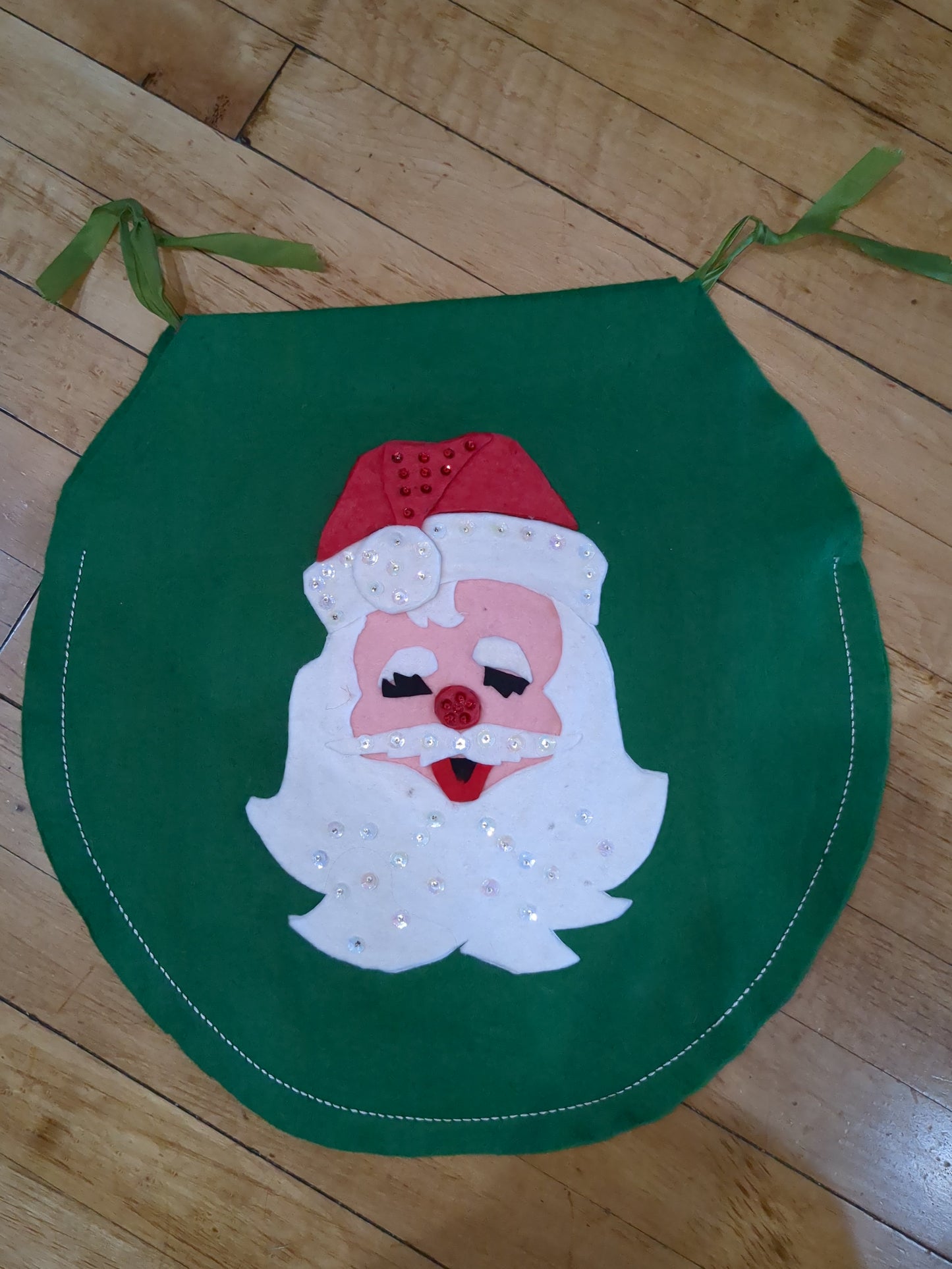 Vintage handmade felt toilet lid cover Santa covering eyes.