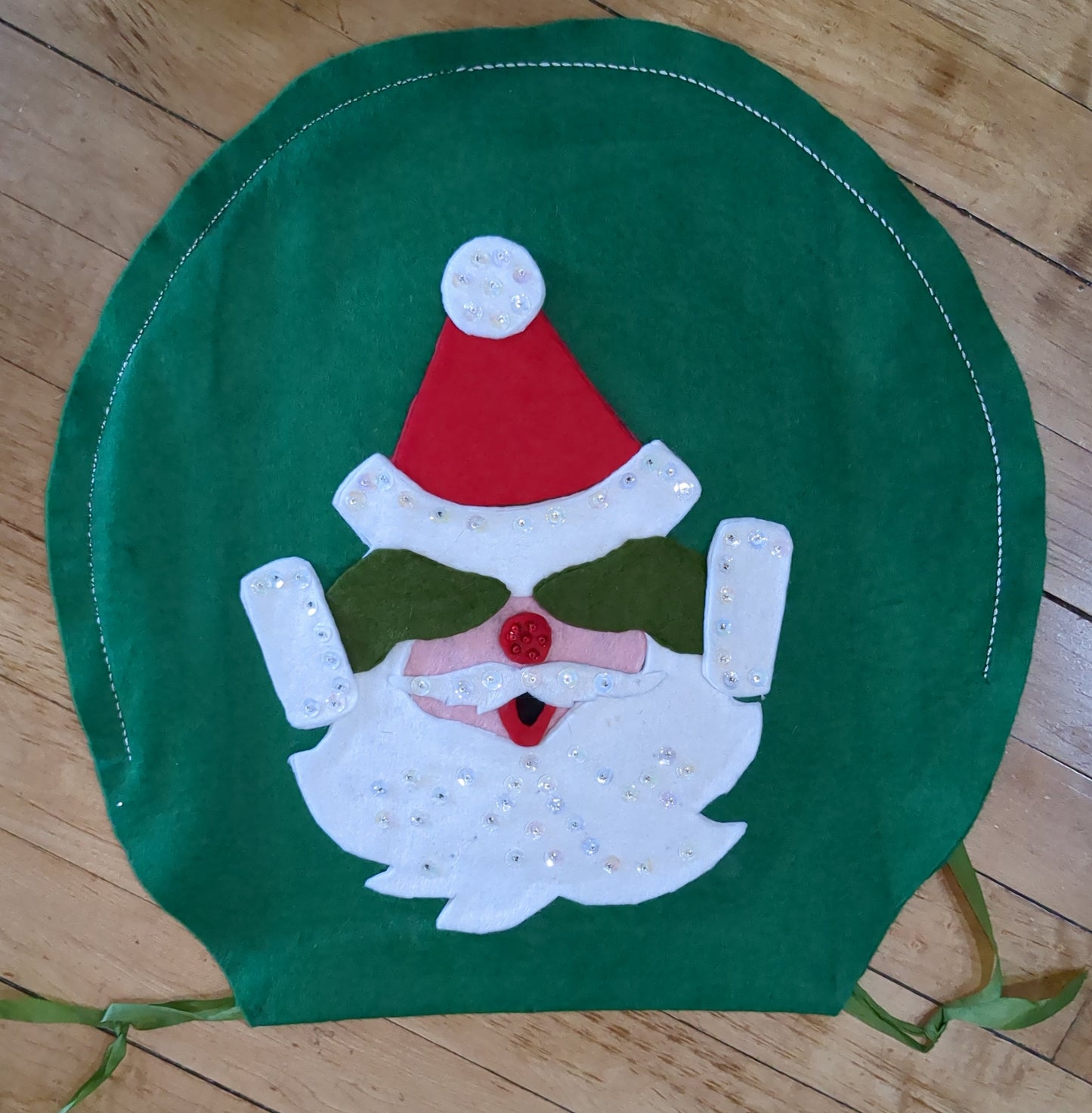 Vintage handmade felt toilet lid cover Santa covering eyes.