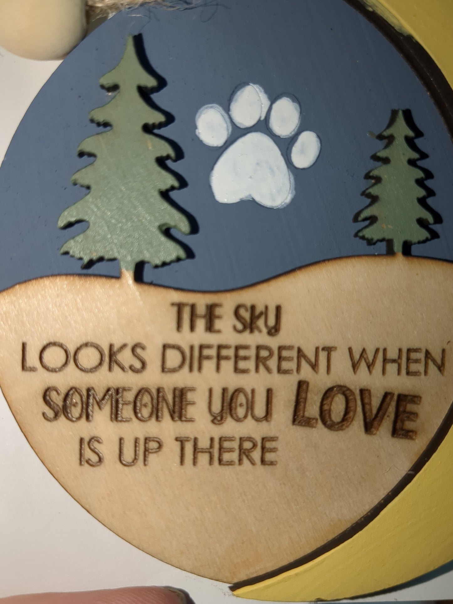 Ornament the sky looks different when someone you love is up there with pet paw. Memorial for loss of loved pet
