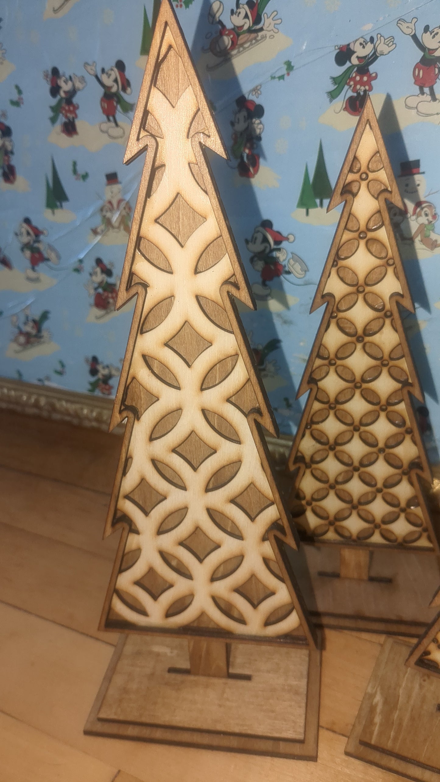 Standing wooden patterned layered trees. Unique decor pieces sold as a set.