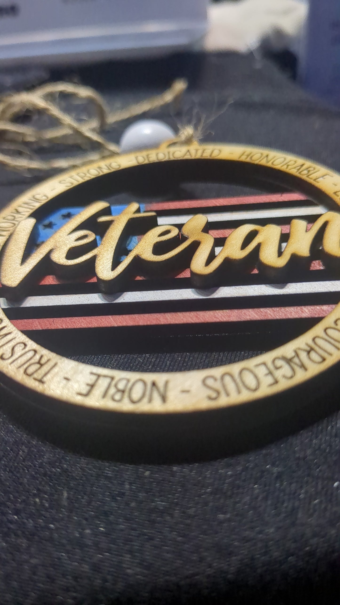 Wooden ornament or car charm. Veteran