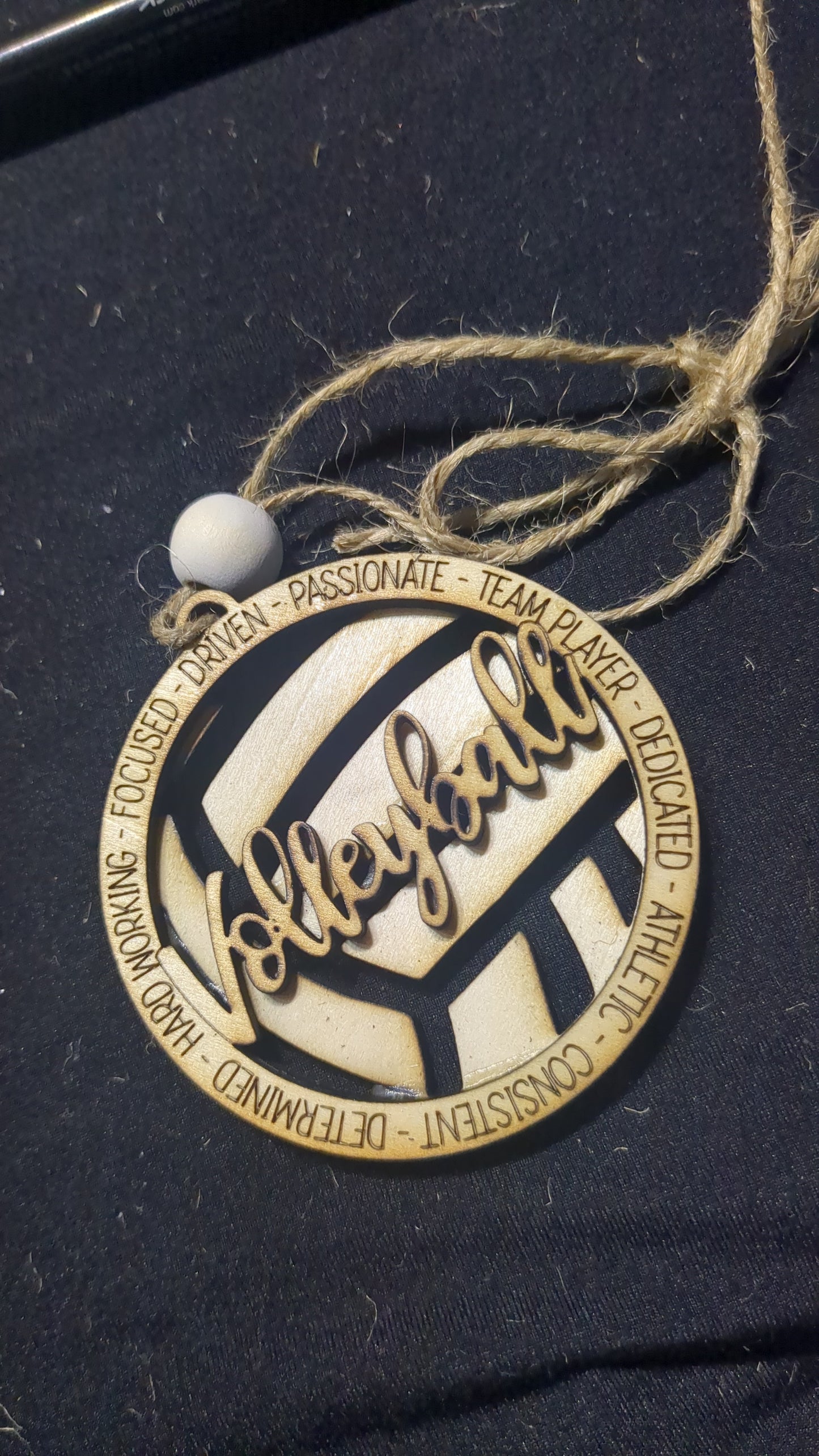 Wooden ornament or car charm. Volleyball