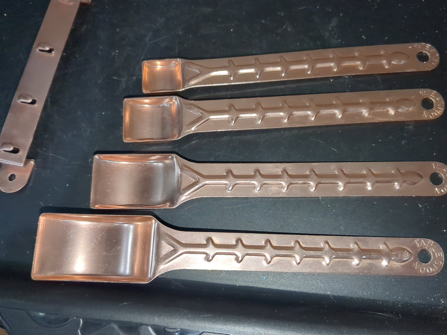 Vintage aluminum pink or copper colored measuring spoons with hanging rail alu253