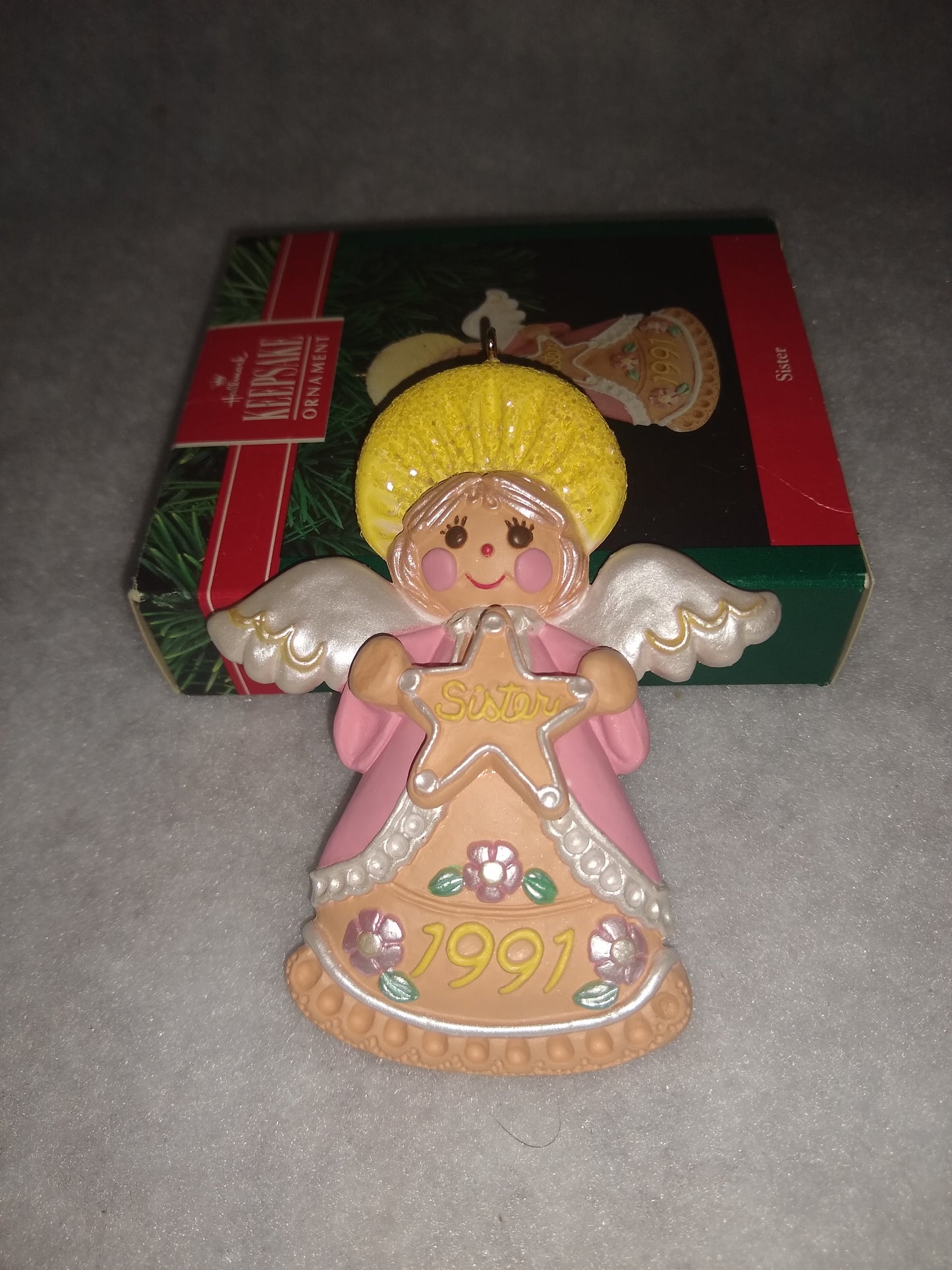 Vintage 1991 Hallmark Keepsake ornament Angel Holding gingerbread star Sister written on it ho92