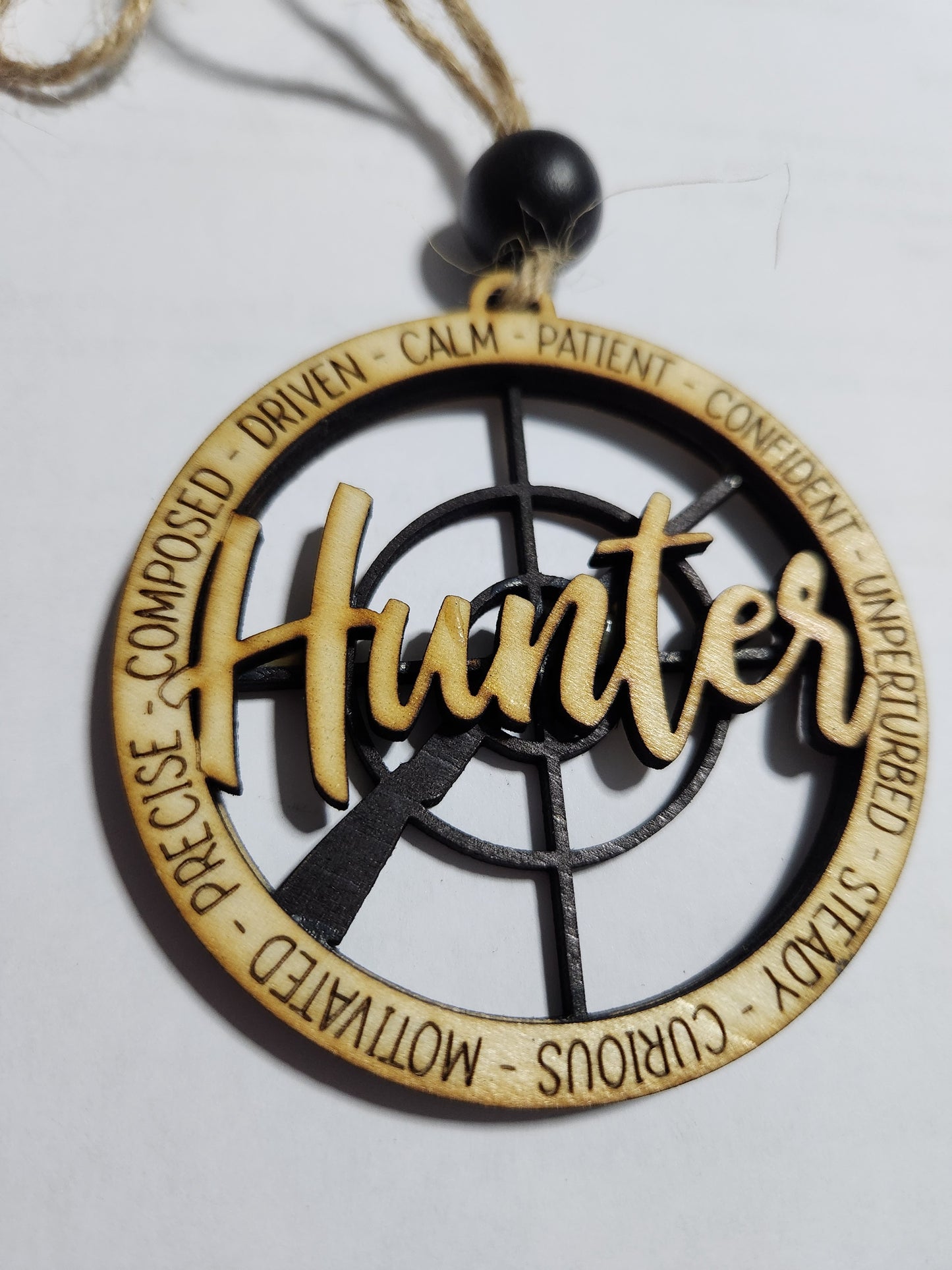 Wooden ornament or car charm. Hunter