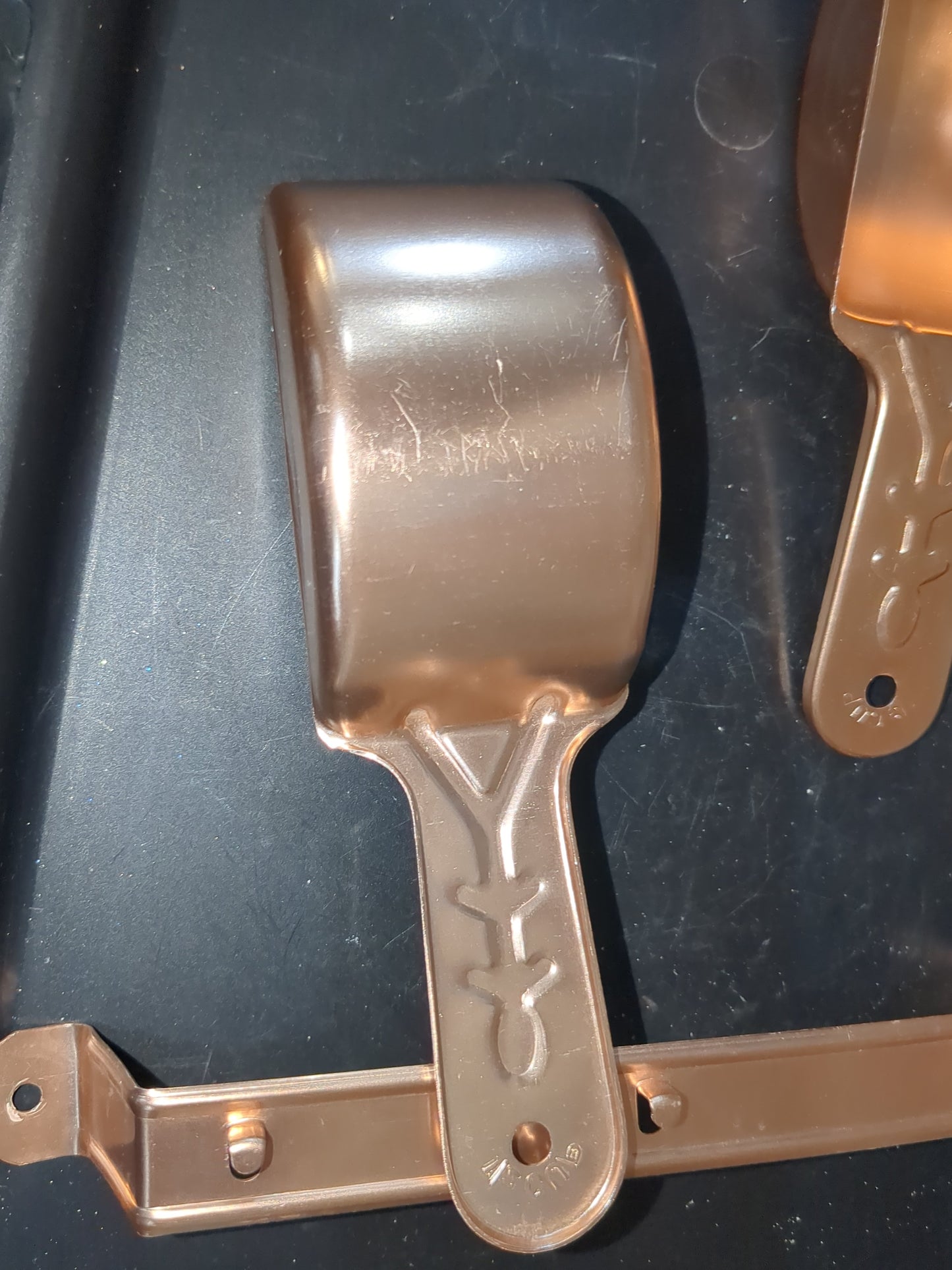 Vintage aluminum pink or copper colored measuring cups with hanging rail alu2355