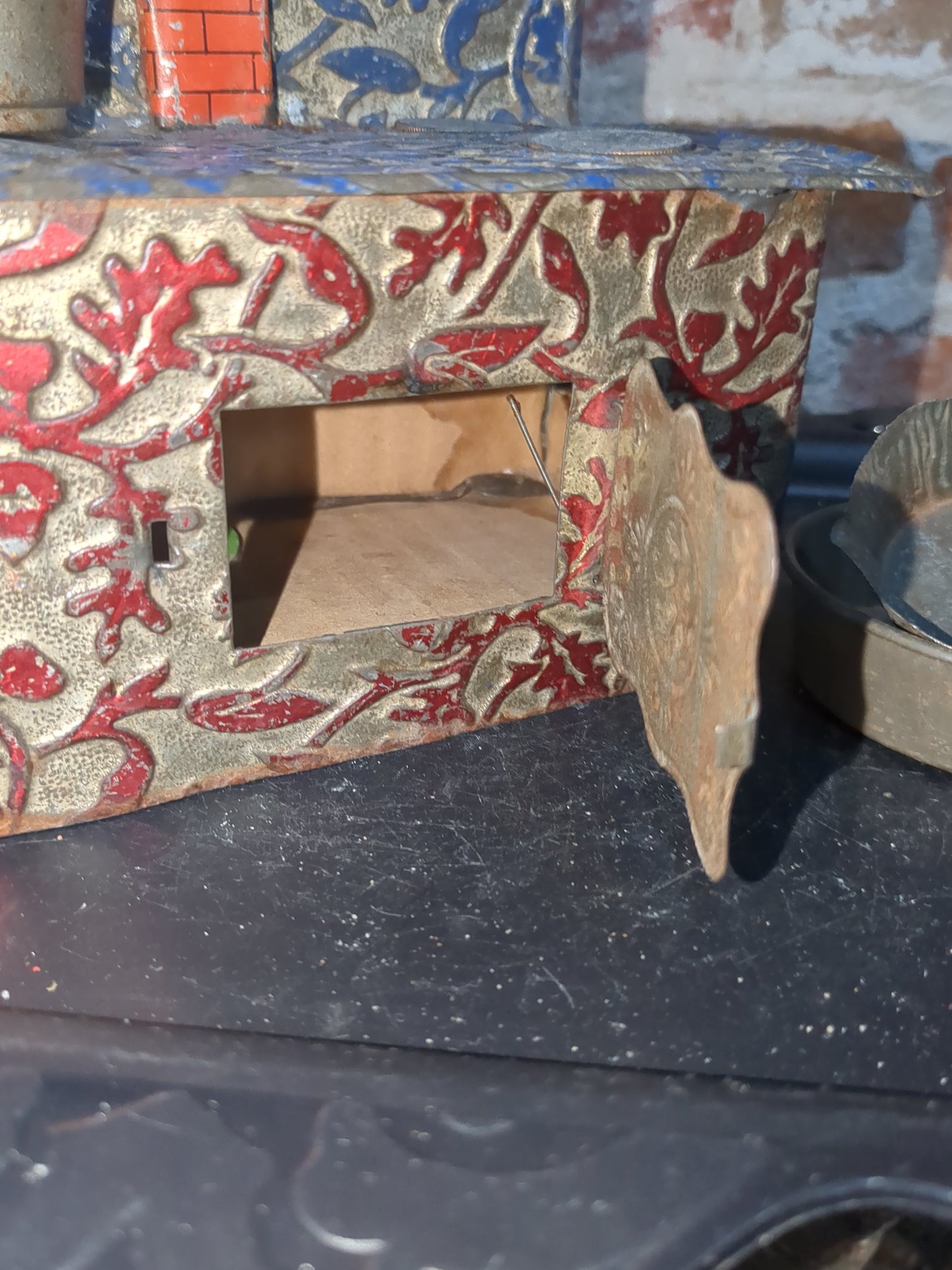 Antique German embossed wood stove with pans. Kid67