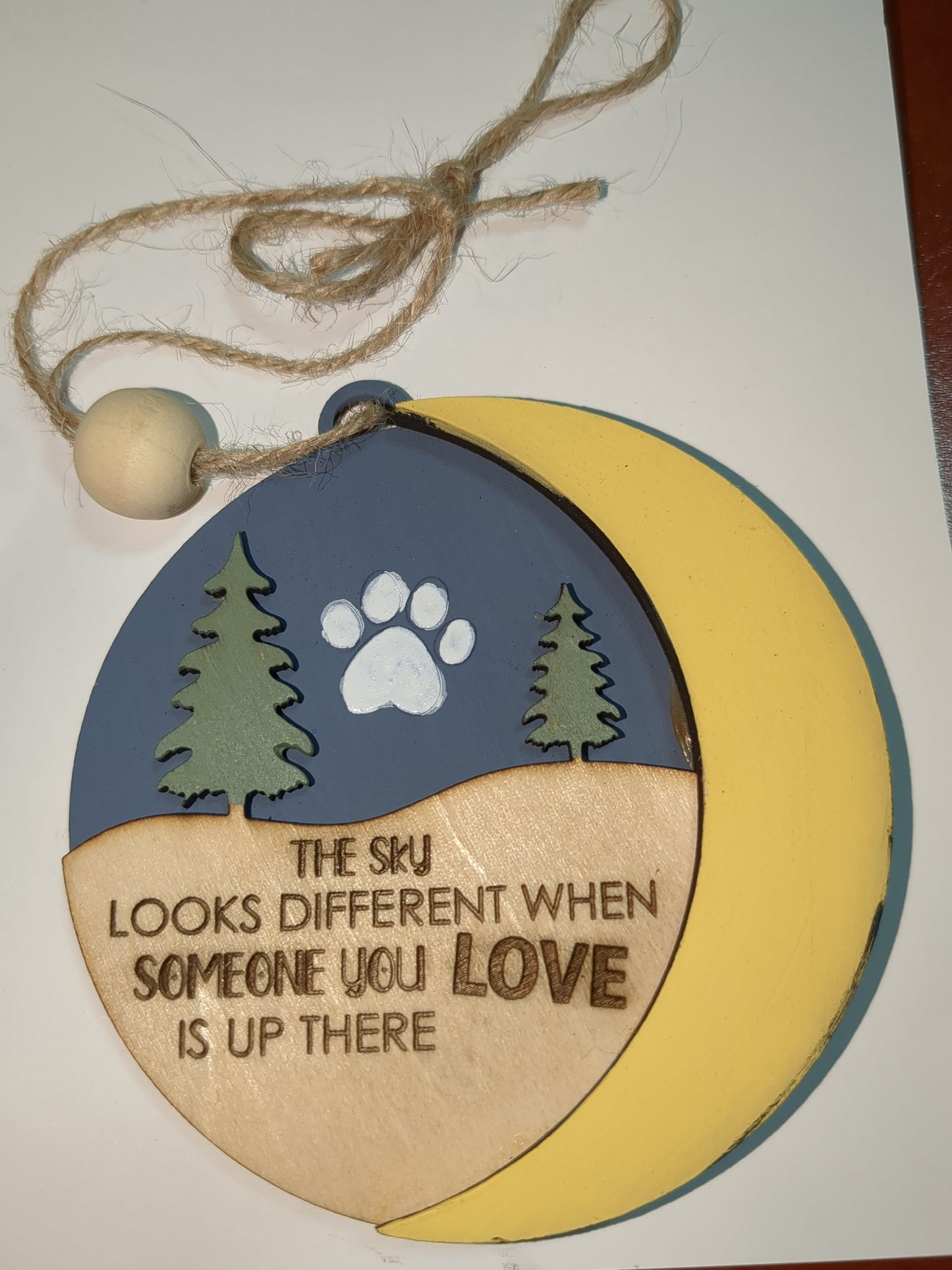 Ornament the sky looks different when someone you love is up there with pet paw. Memorial for loss of loved pet