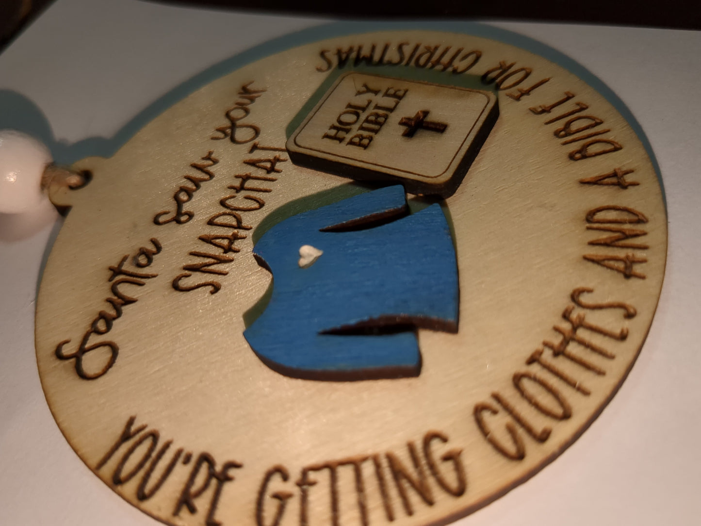 Ornament or car charm.  Santa saw your Snapchat