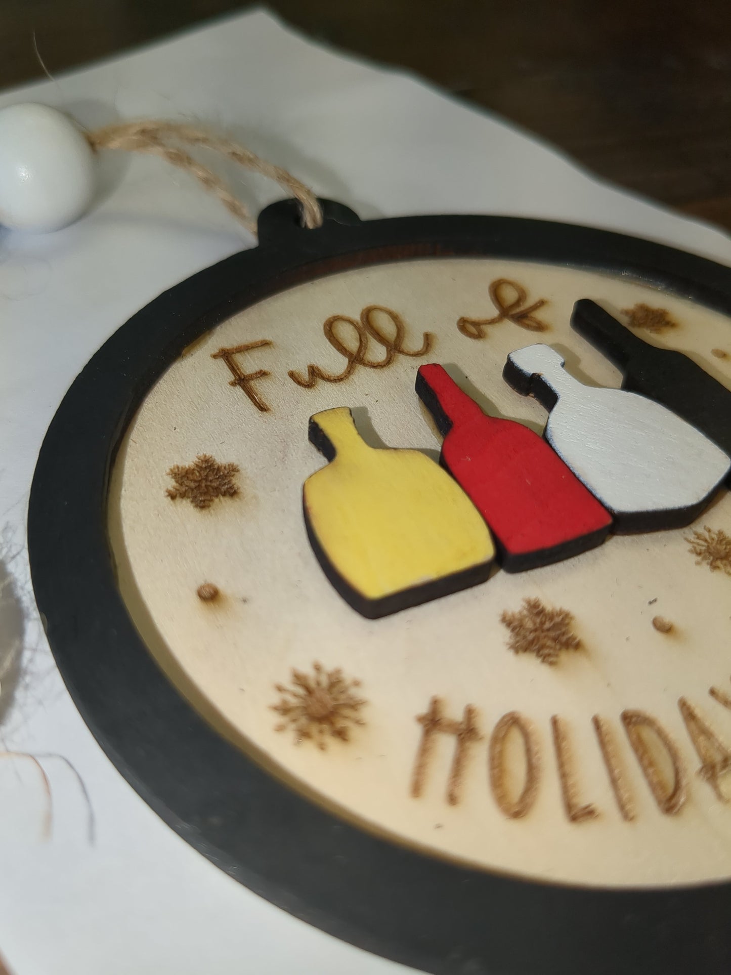 Wooden ornament or car charm. Full of holiday spirits.