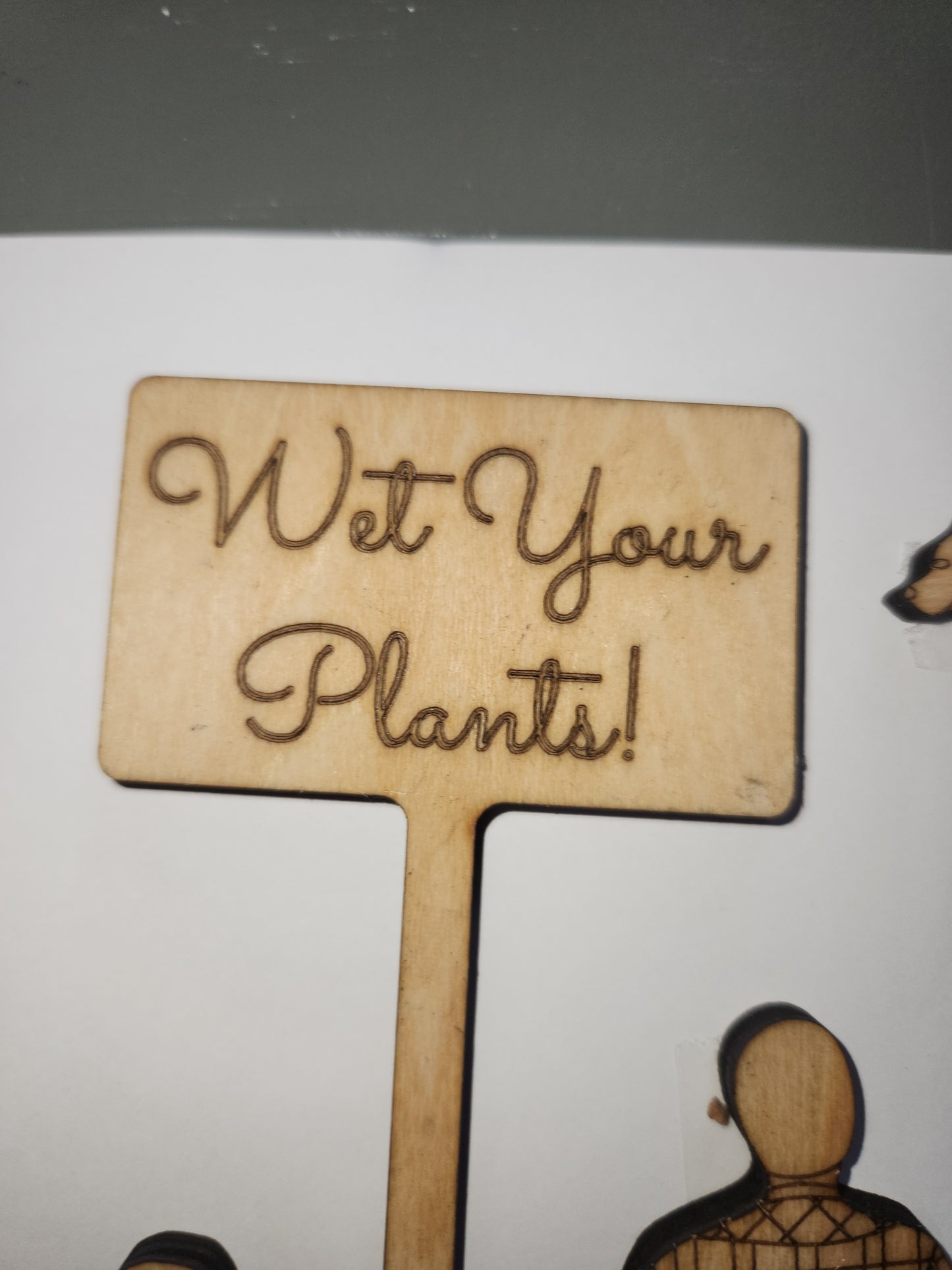 Wet Your Plants potting plant stakes dog, man, woman boy