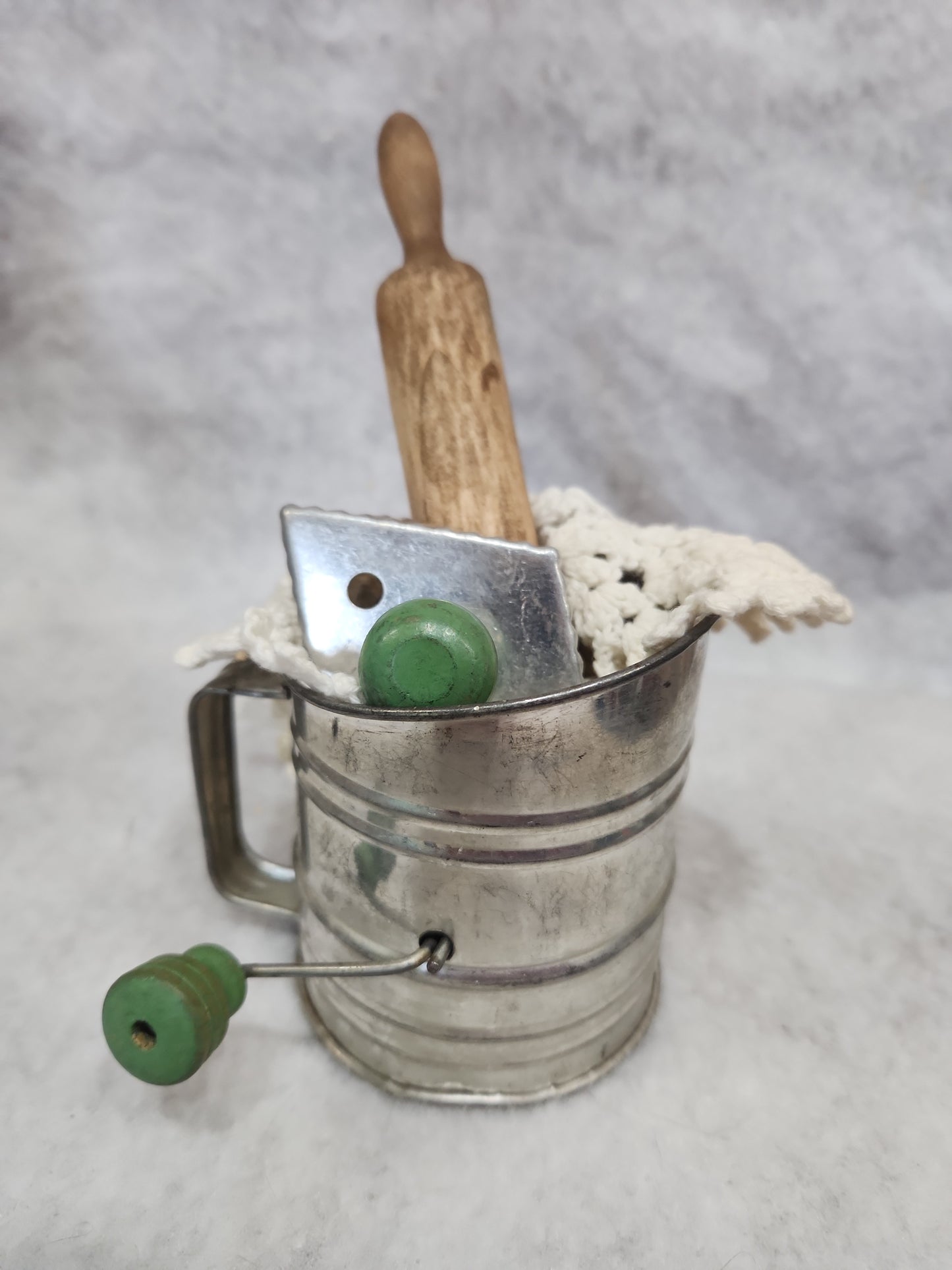 Flour sifter, rolling pin, doily, cookie cutter assemblage asb21