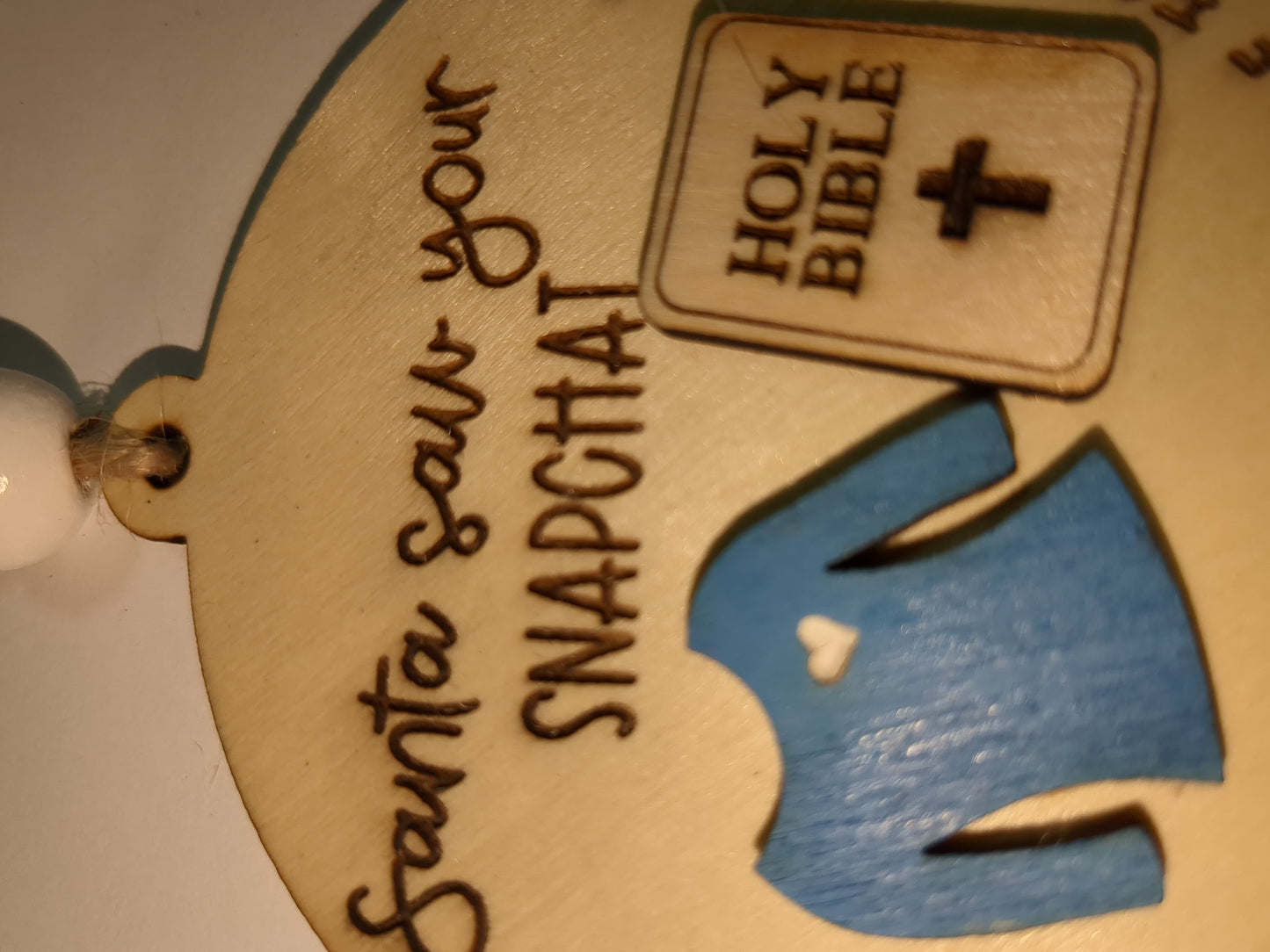 Ornament or car charm.  Santa saw your Snapchat