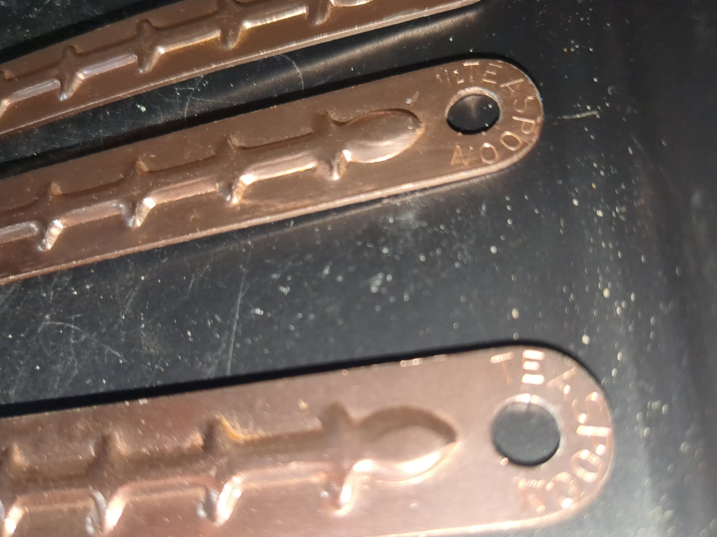 Vintage aluminum pink or copper colored measuring spoons with hanging rail alu253