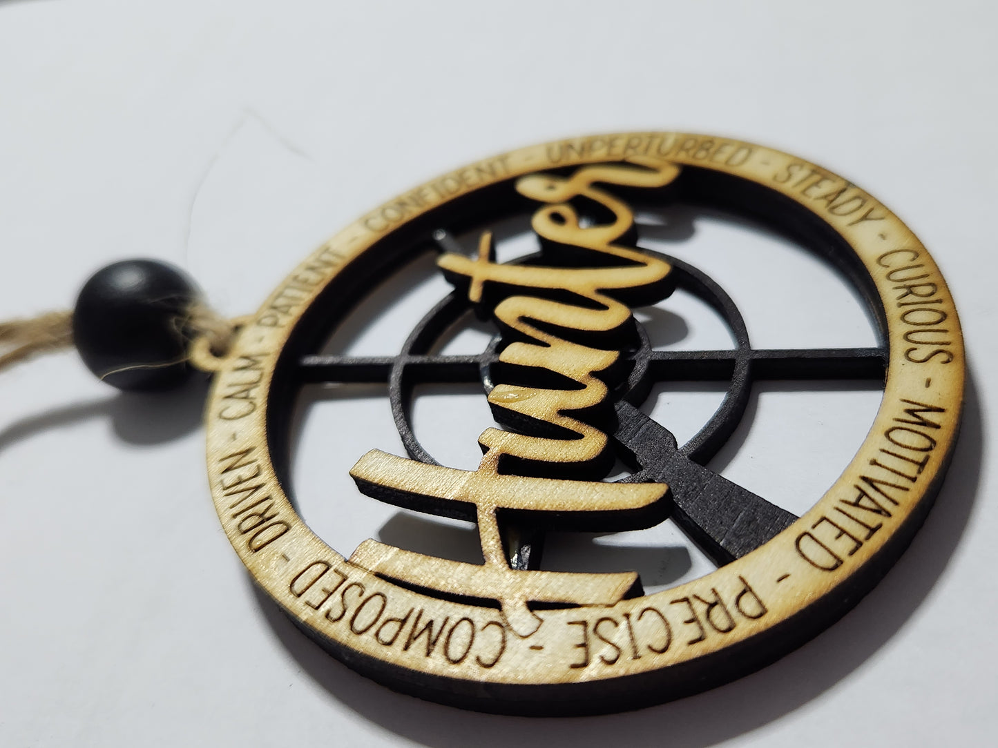Wooden ornament or car charm. Hunter