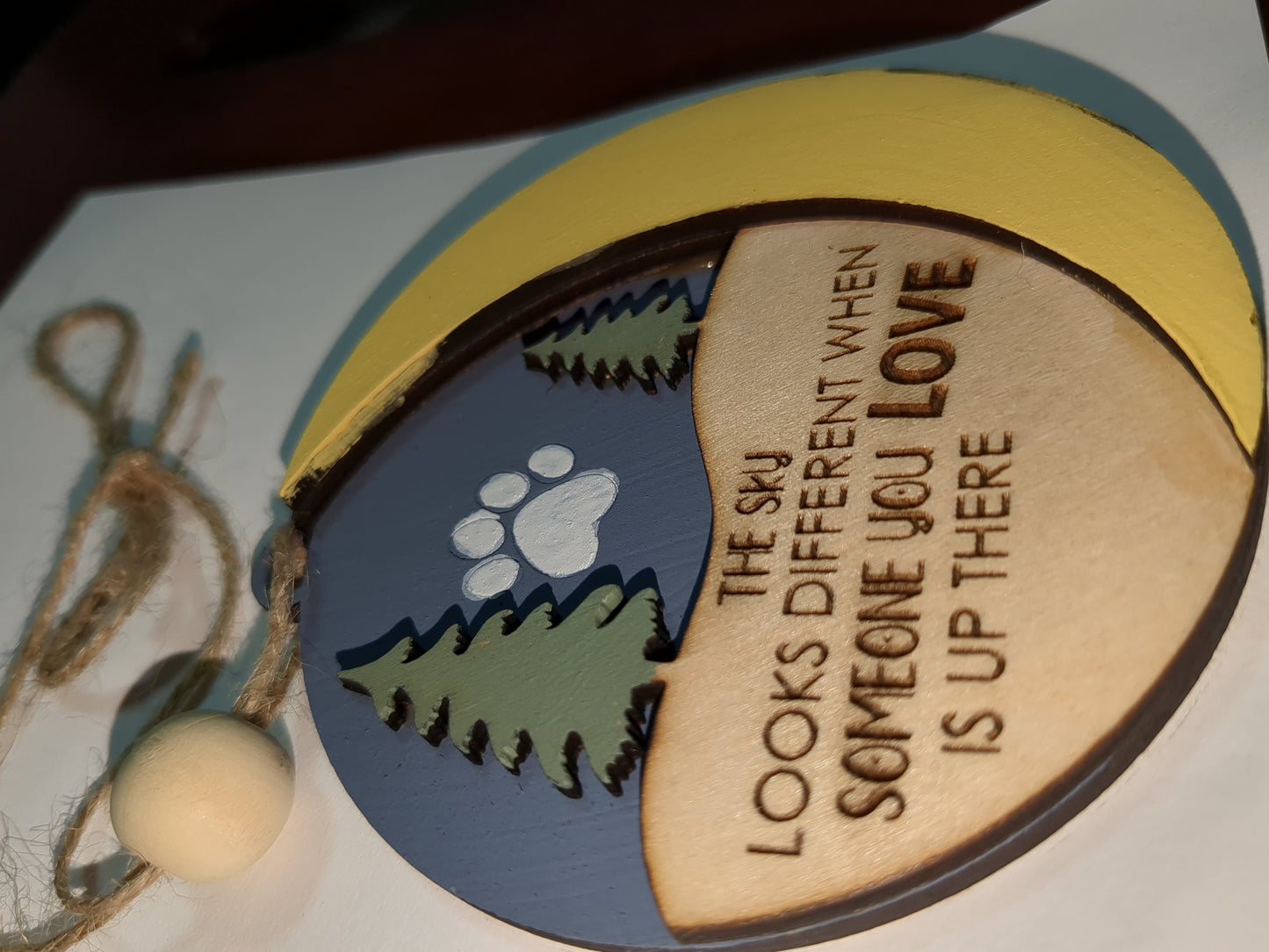 Ornament the sky looks different when someone you love is up there with pet paw. Memorial for loss of loved pet
