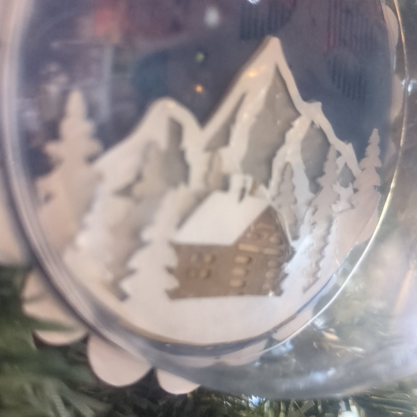Layered 3D ornaments cabin and northern lights