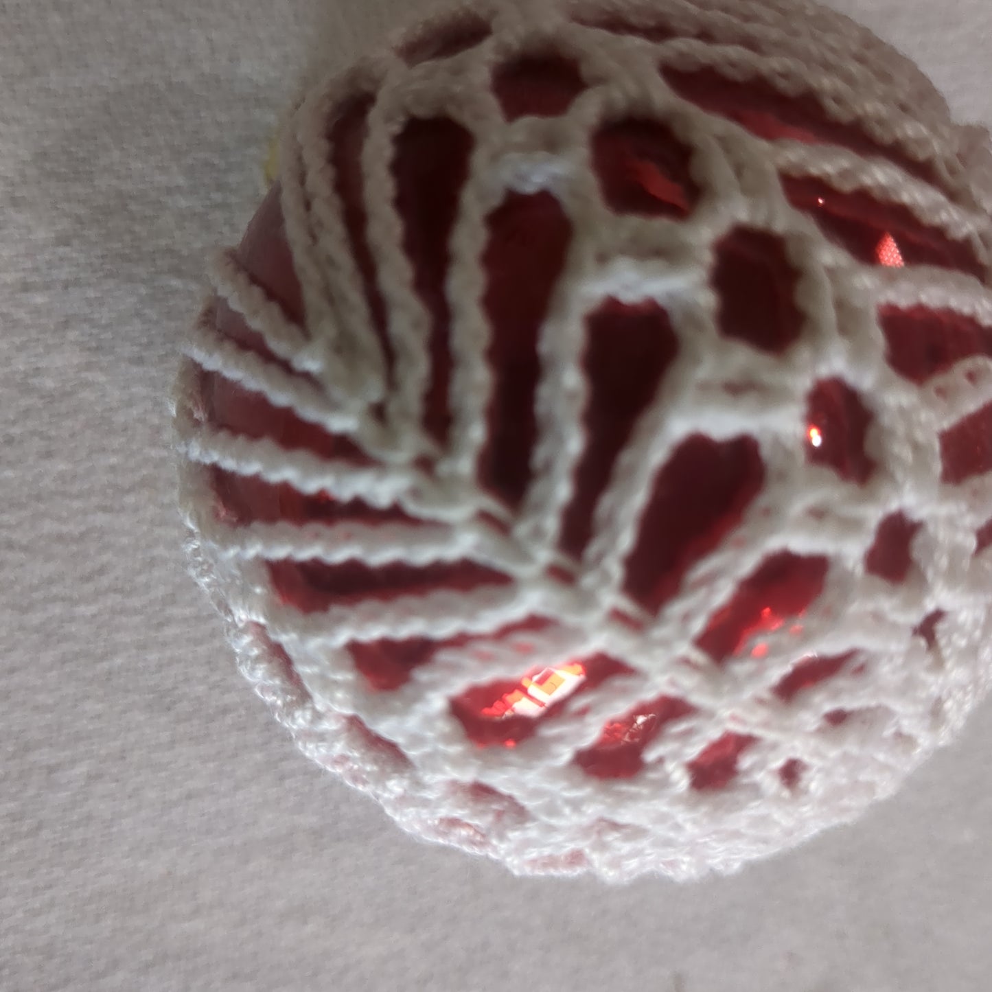Red glass ornament with crochet perfect for Valentine's Day