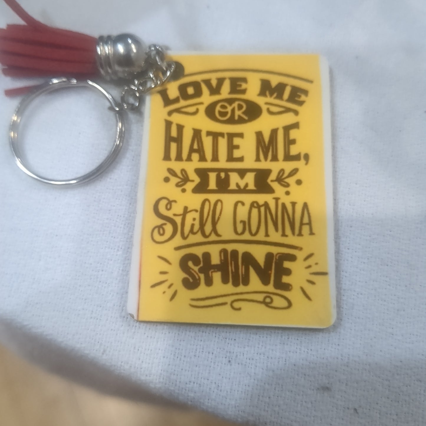Keychain love me or hate me I'm still gonna shine