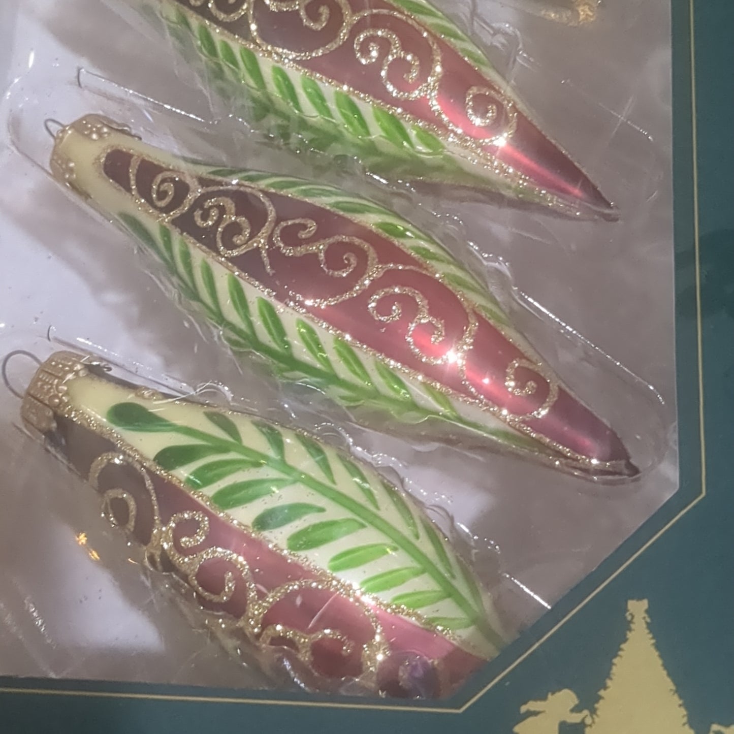 Ornament Chablis Gold Shapes Leaves Scrolls Gold Caps skinny oval