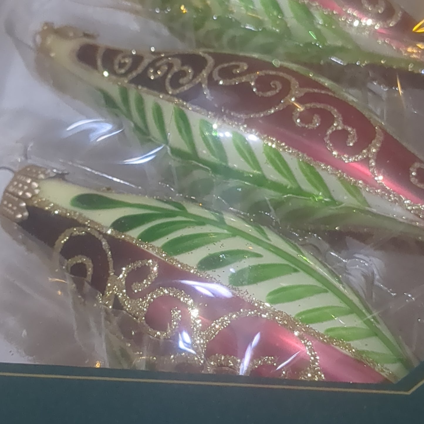 Ornament Chablis Gold Shapes Leaves Scrolls Gold Caps skinny oval